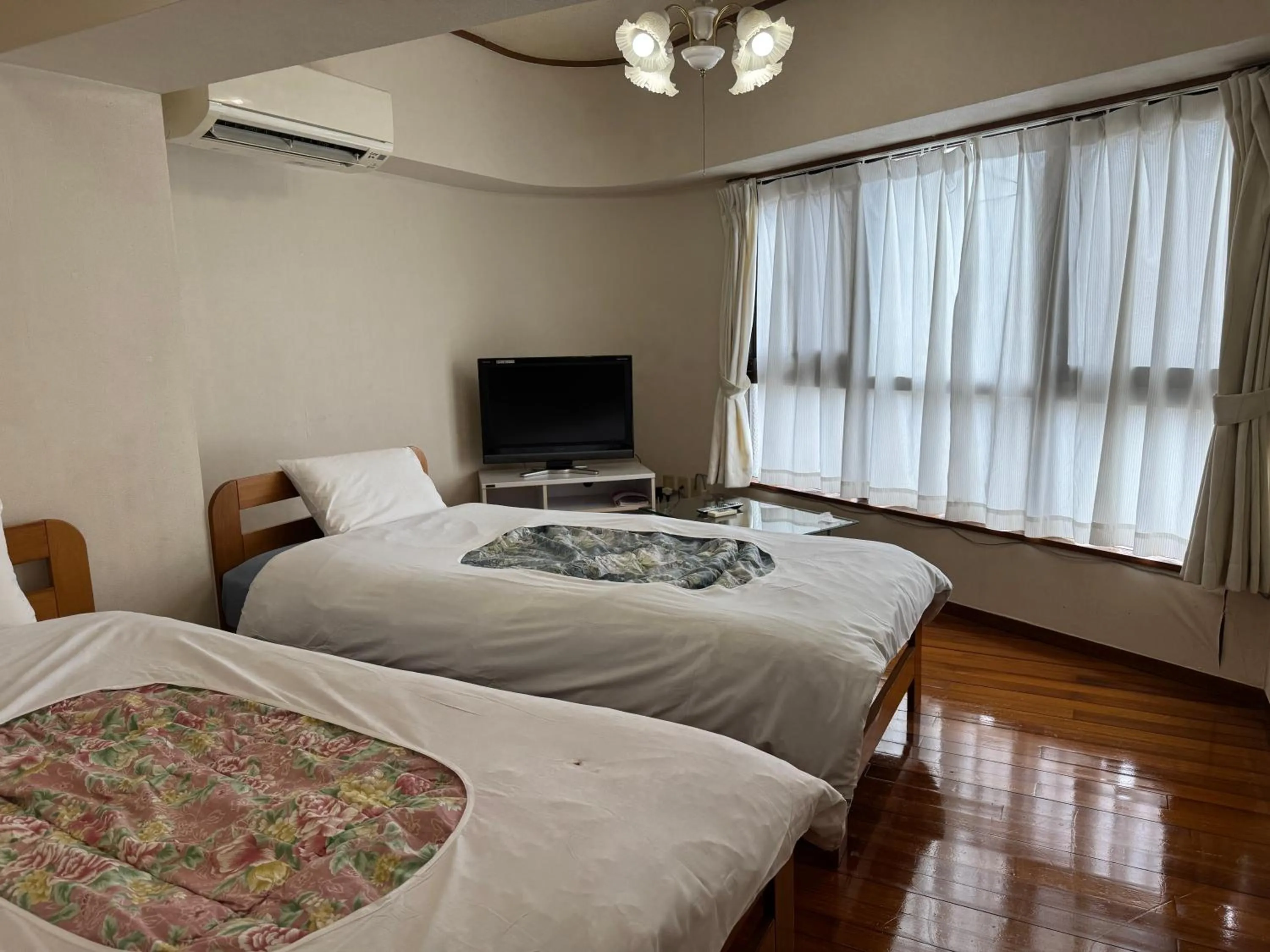 Bed in Kokusai Towns Inn