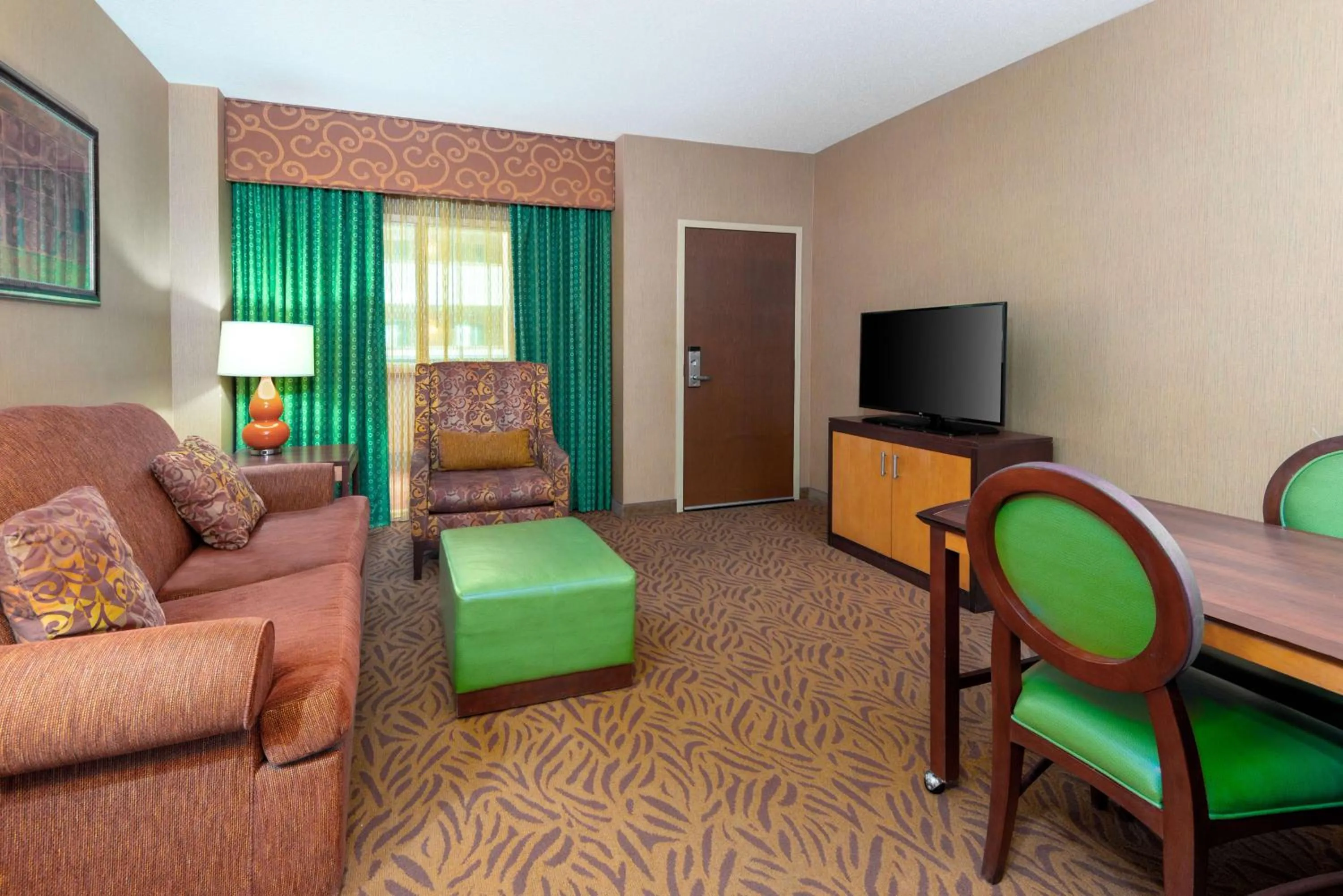 Bedroom in Embassy Suites Omaha- La Vista/ Hotel & Conference Center