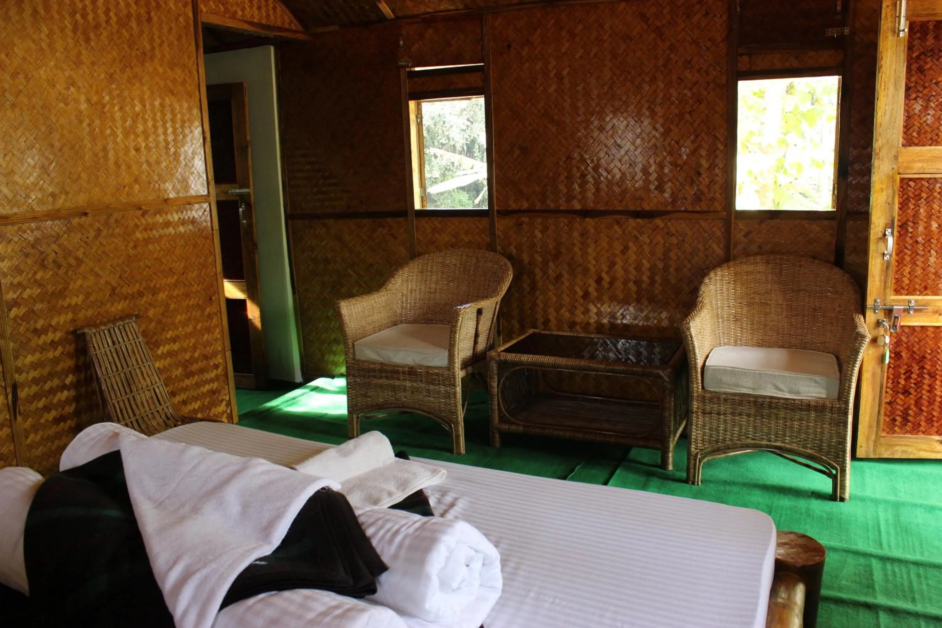 Seating area, Bed in Nature Hunt Eco Camp
