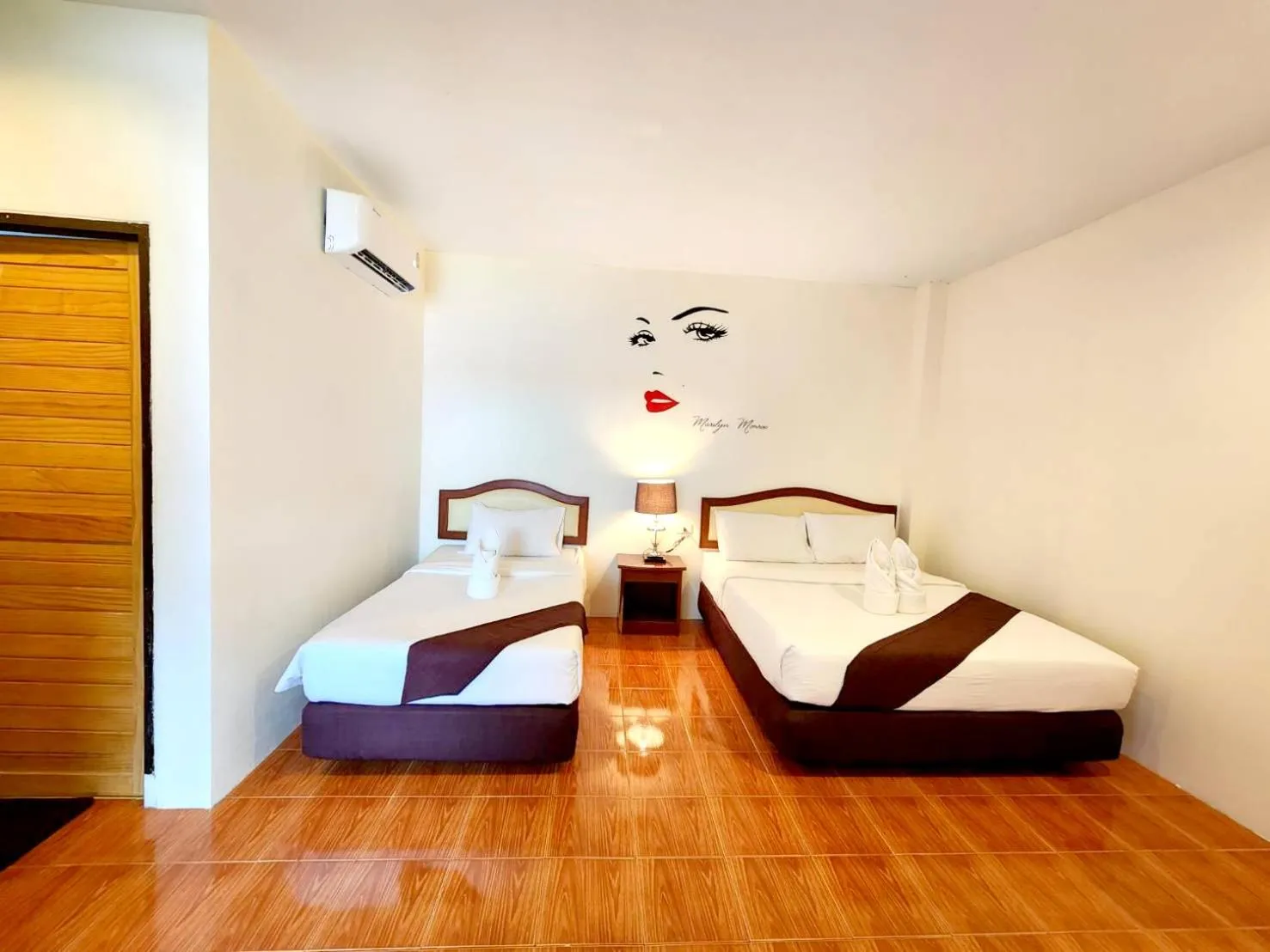 Bed in Mild Garden View Resort