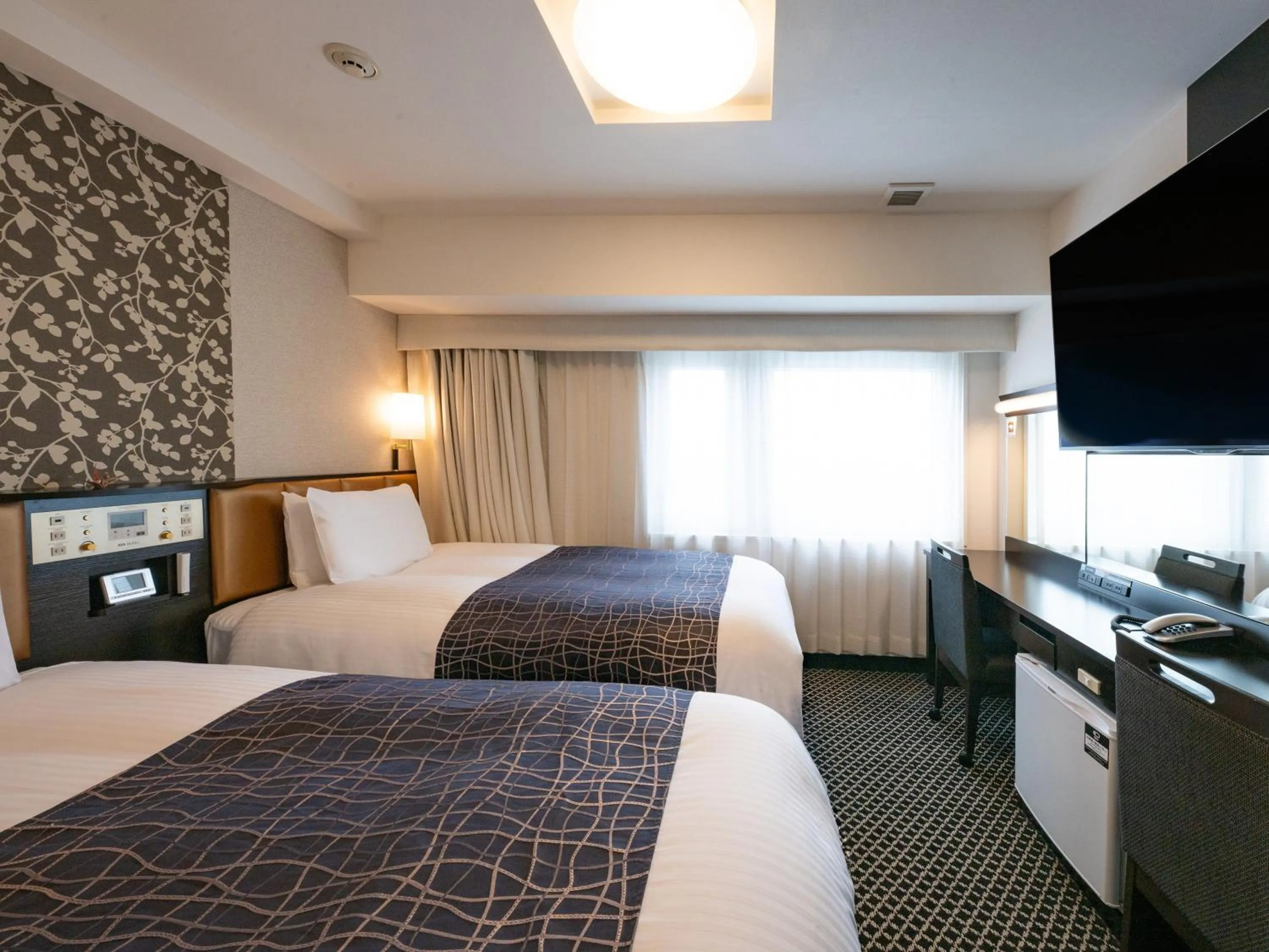 Photo of the whole room, Bed in APA Hotel & Resort Nishishinjuku Gochome Ekimae Tower - Formerly APA Hotel & Resort Nishishinjuku Gochome Eki Tower