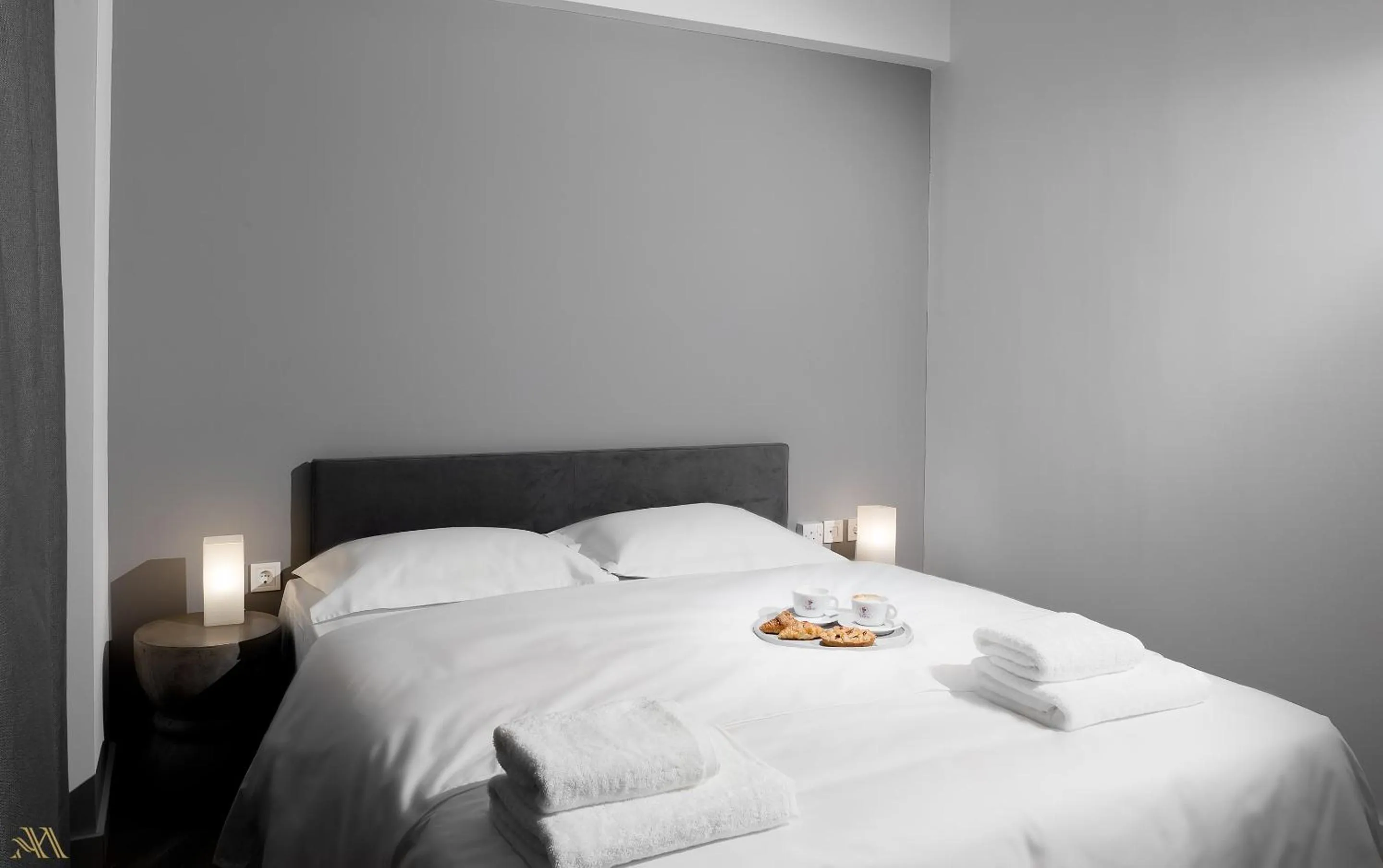 Bed in Elysium Boutique Apartments