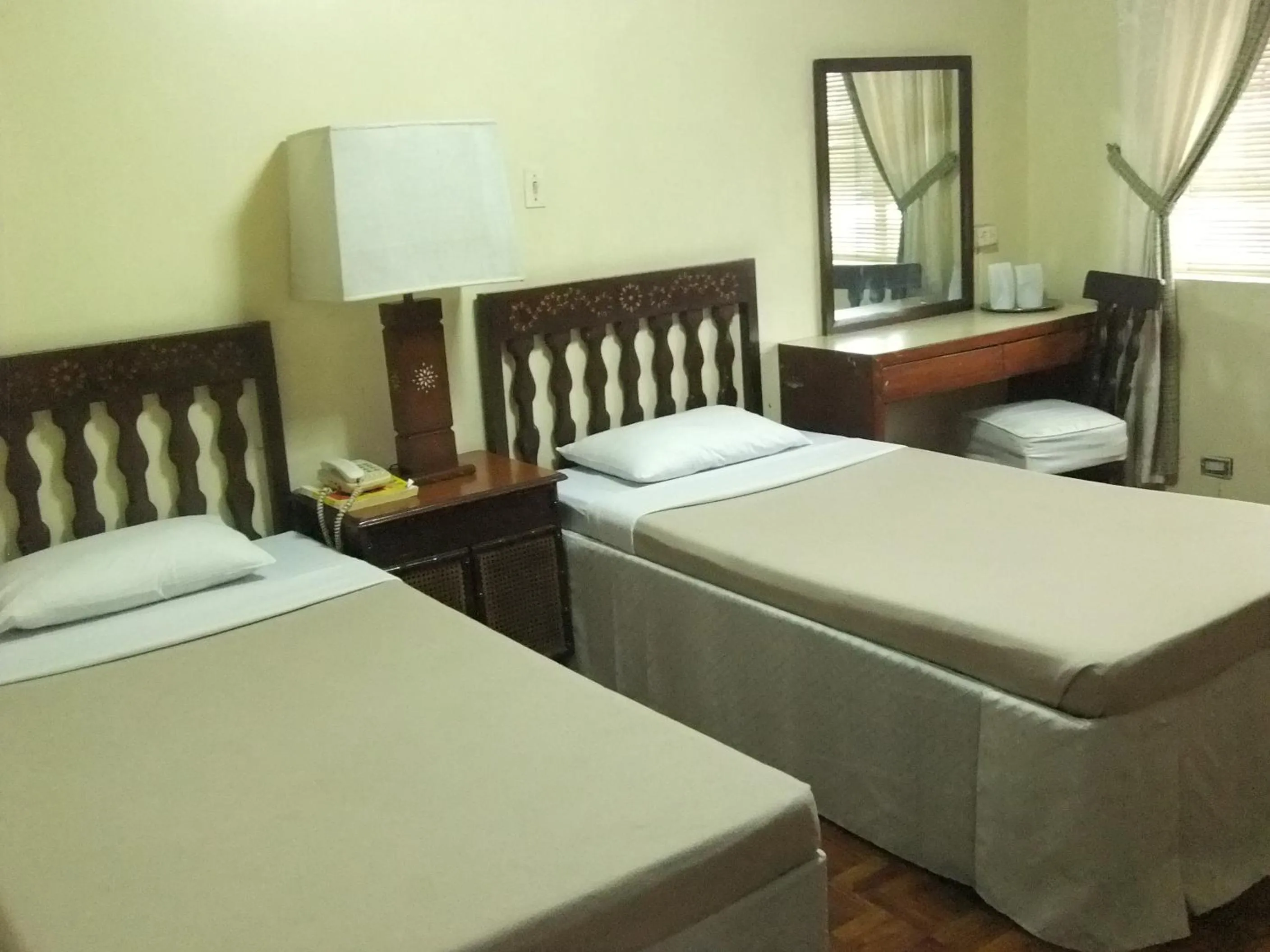 Bed in Manila Manor Hotel