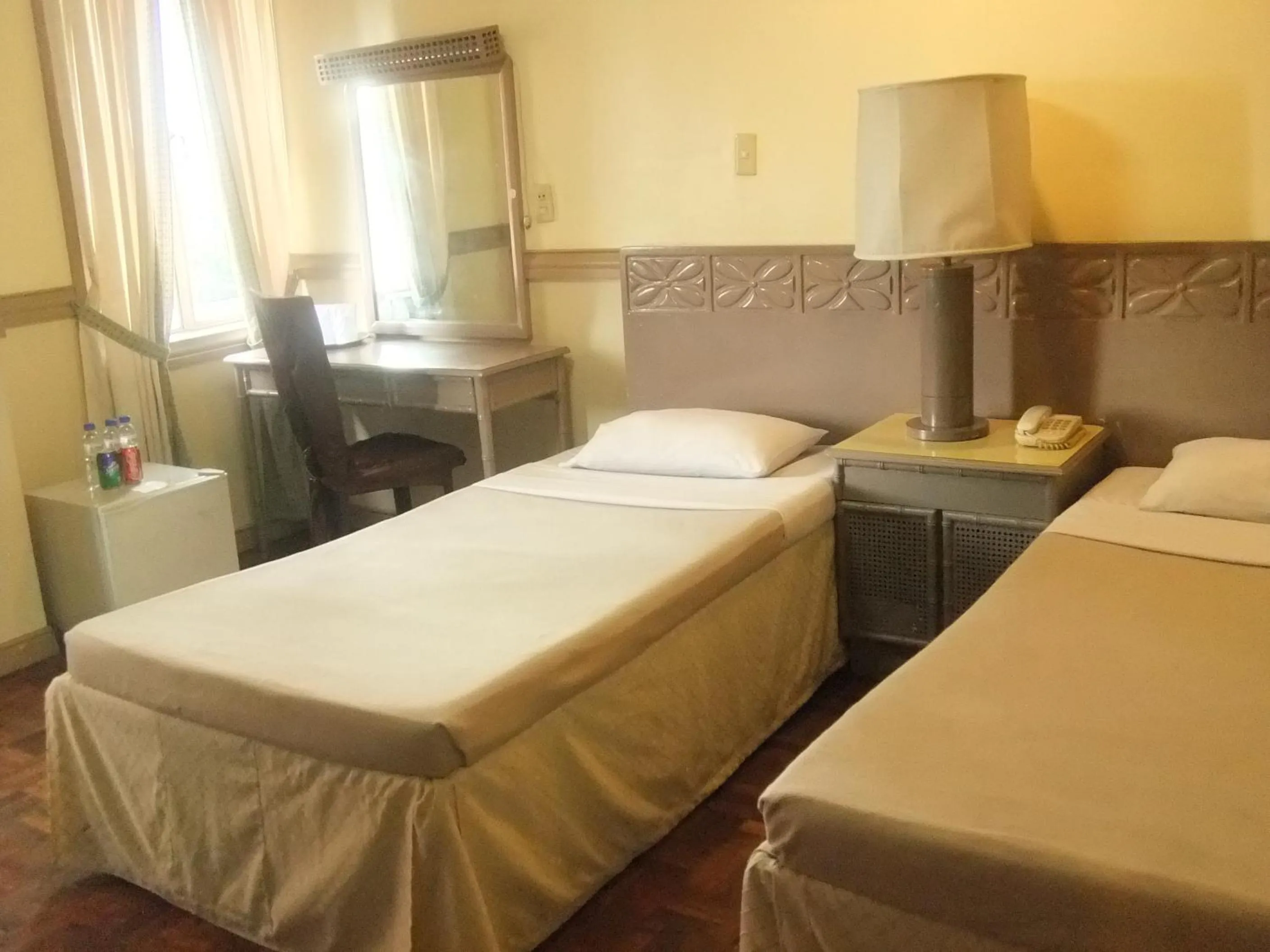 Bed in Manila Manor Hotel