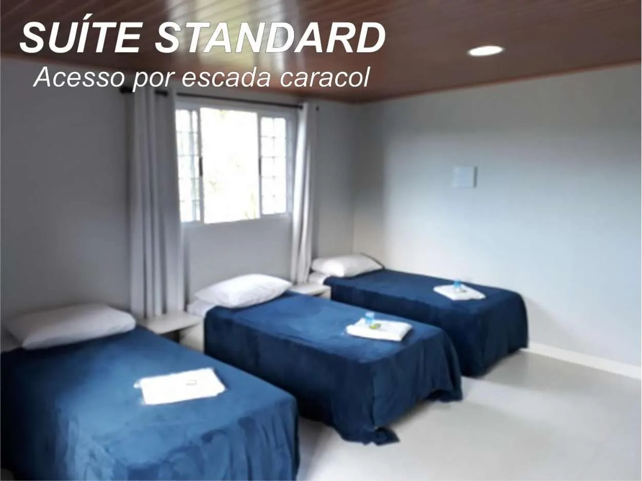 Bed in Pousada TOP Mairiporã