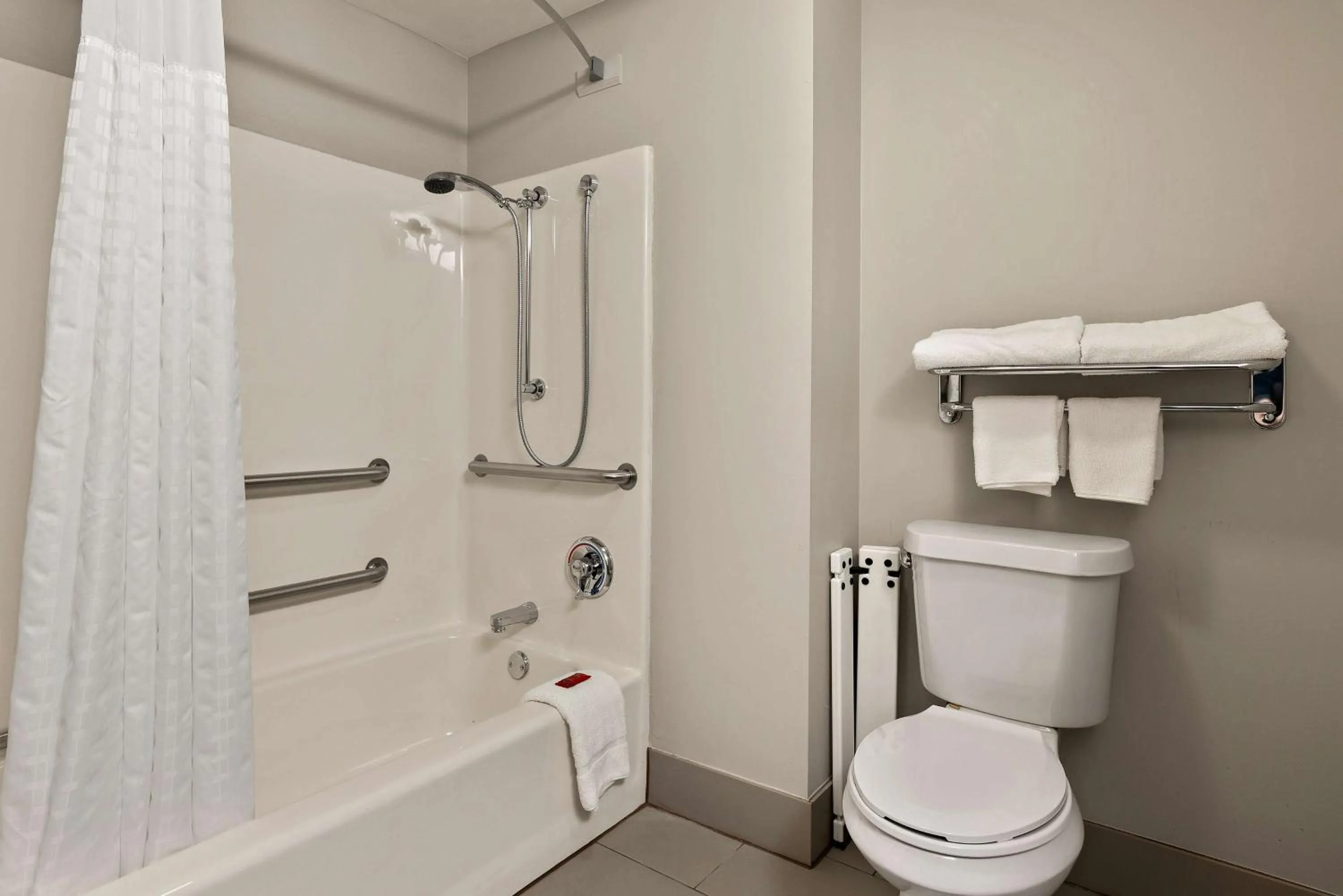 Bathroom in SureStay Plus Hotel by Best Western Tulsa East