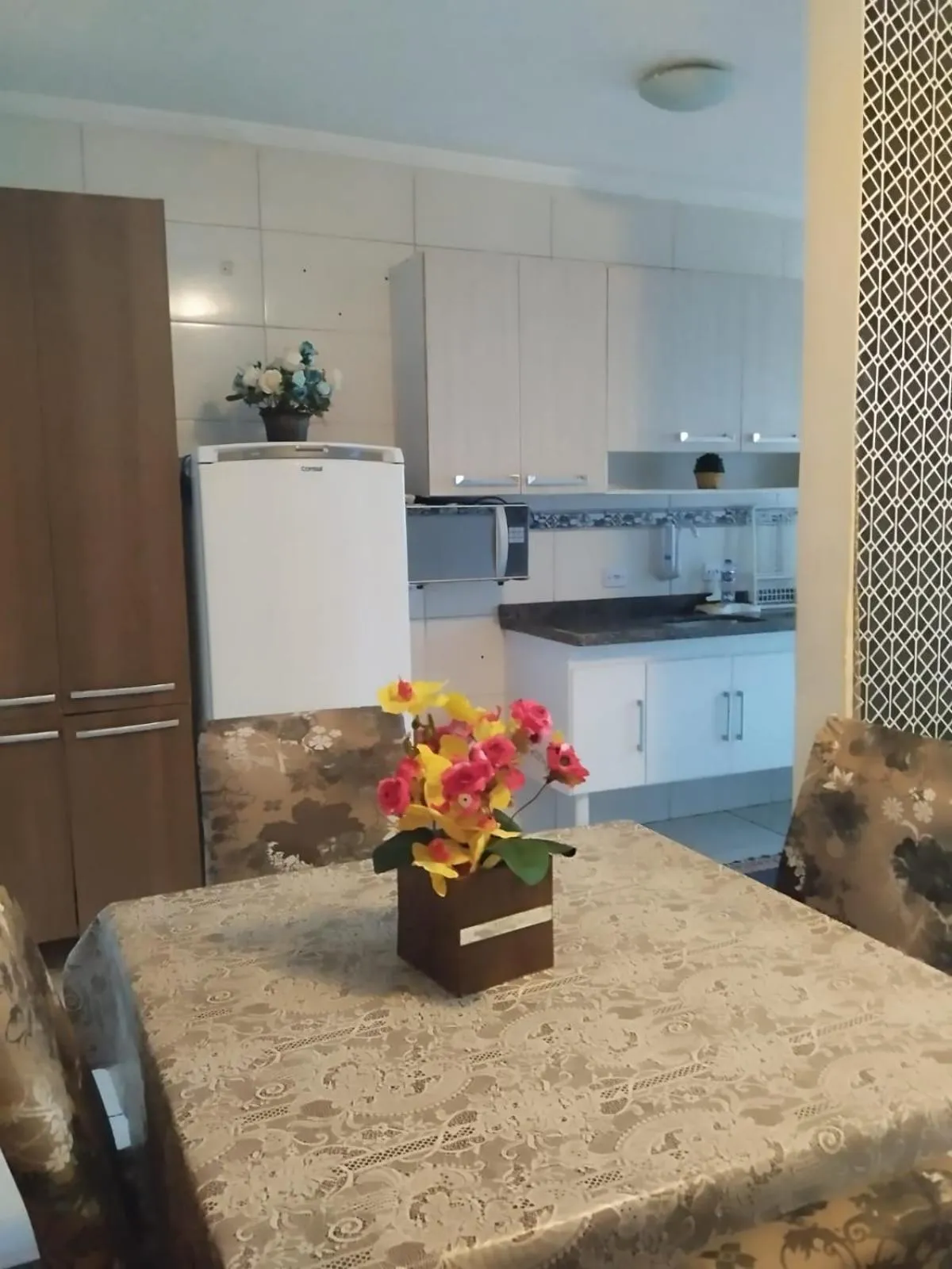 kitchen in Apê Temporada Praia Grande SP Completo com Piscina, Churrasqueira, Estacionamento, Wi-Fi