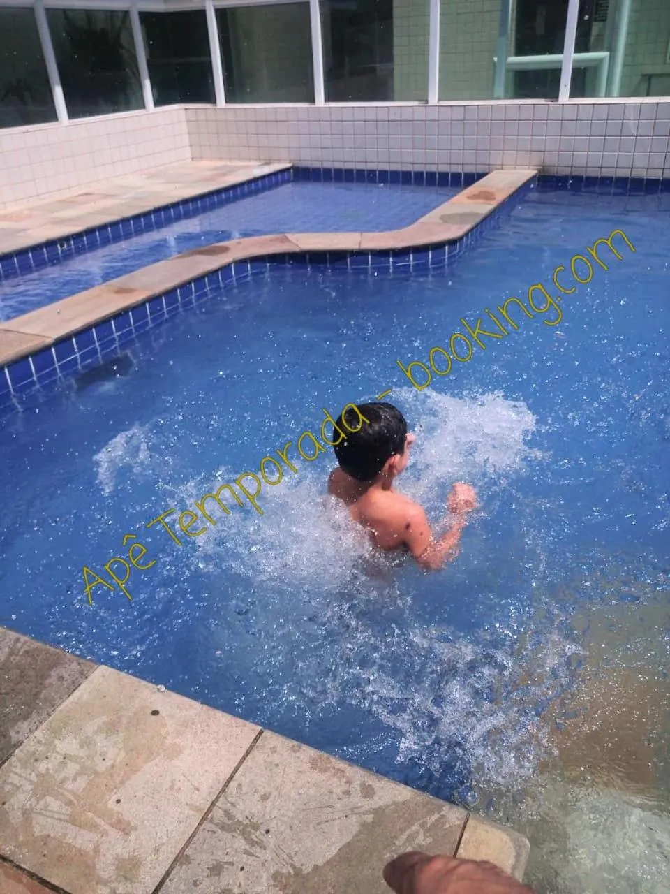 Swimming pool in Apê Temporada Praia Grande SP Completo com Piscina, Churrasqueira, Estacionamento, Wi-Fi