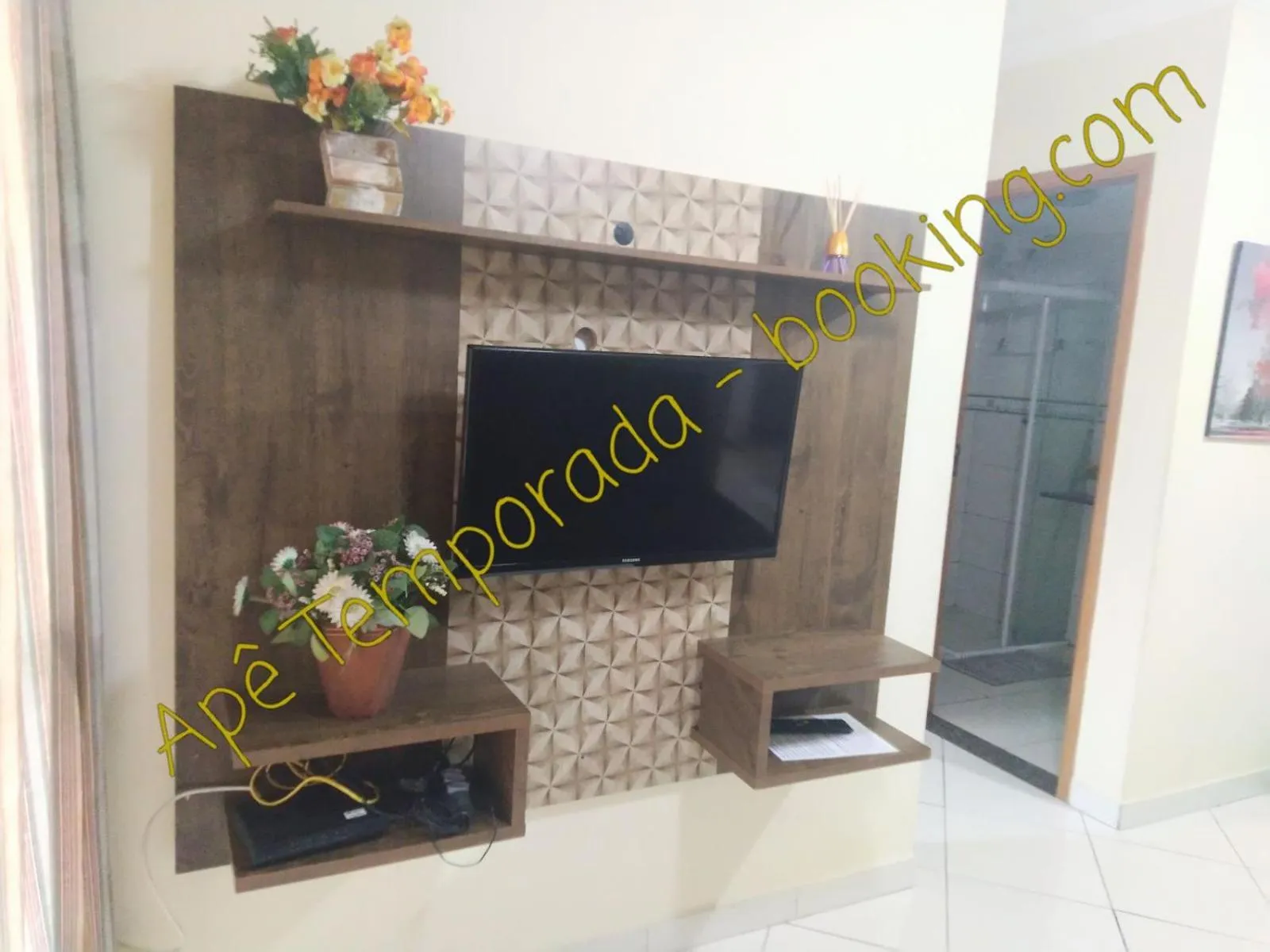 Communal lounge/ TV room in Apê Temporada Praia Grande SP Completo com Piscina, Churrasqueira, Estacionamento, Wi-Fi