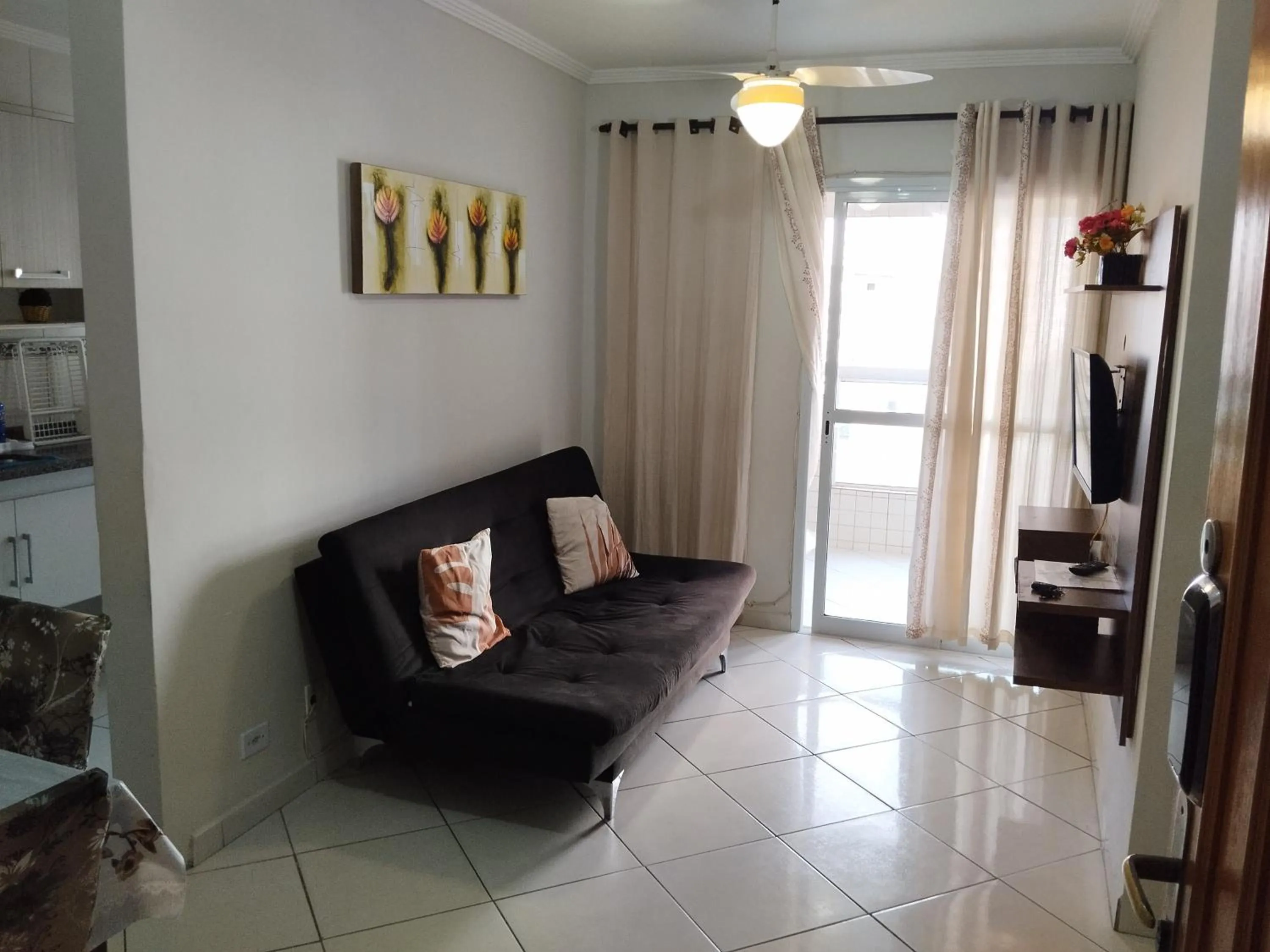 Living room in Apê Temporada Praia Grande SP Completo com Piscina, Churrasqueira, Estacionamento, Wi-Fi