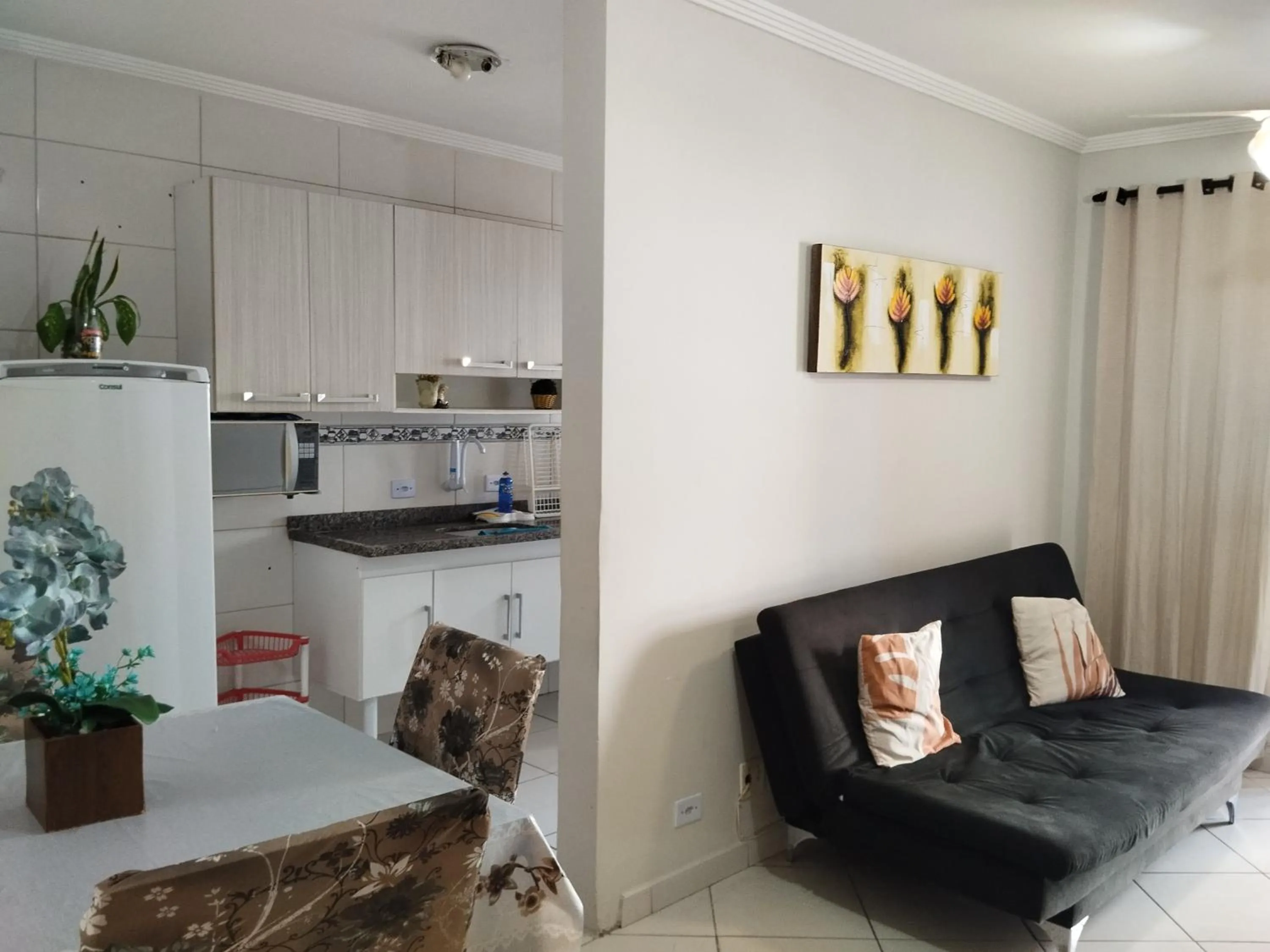 Living room in Apê Temporada Praia Grande SP Completo com Piscina, Churrasqueira, Estacionamento, Wi-Fi