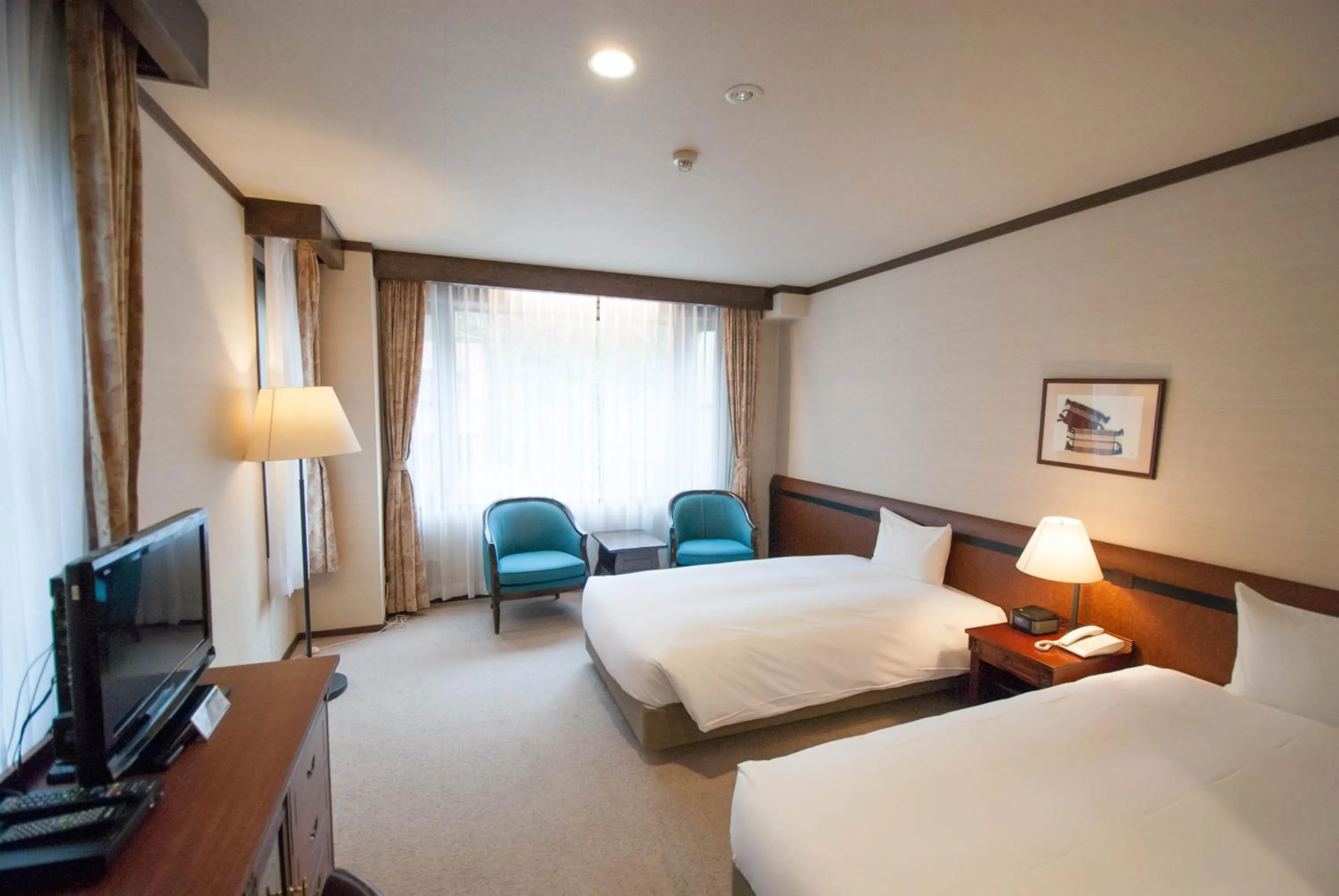 Bed in Hakuba Mominoki Hotel