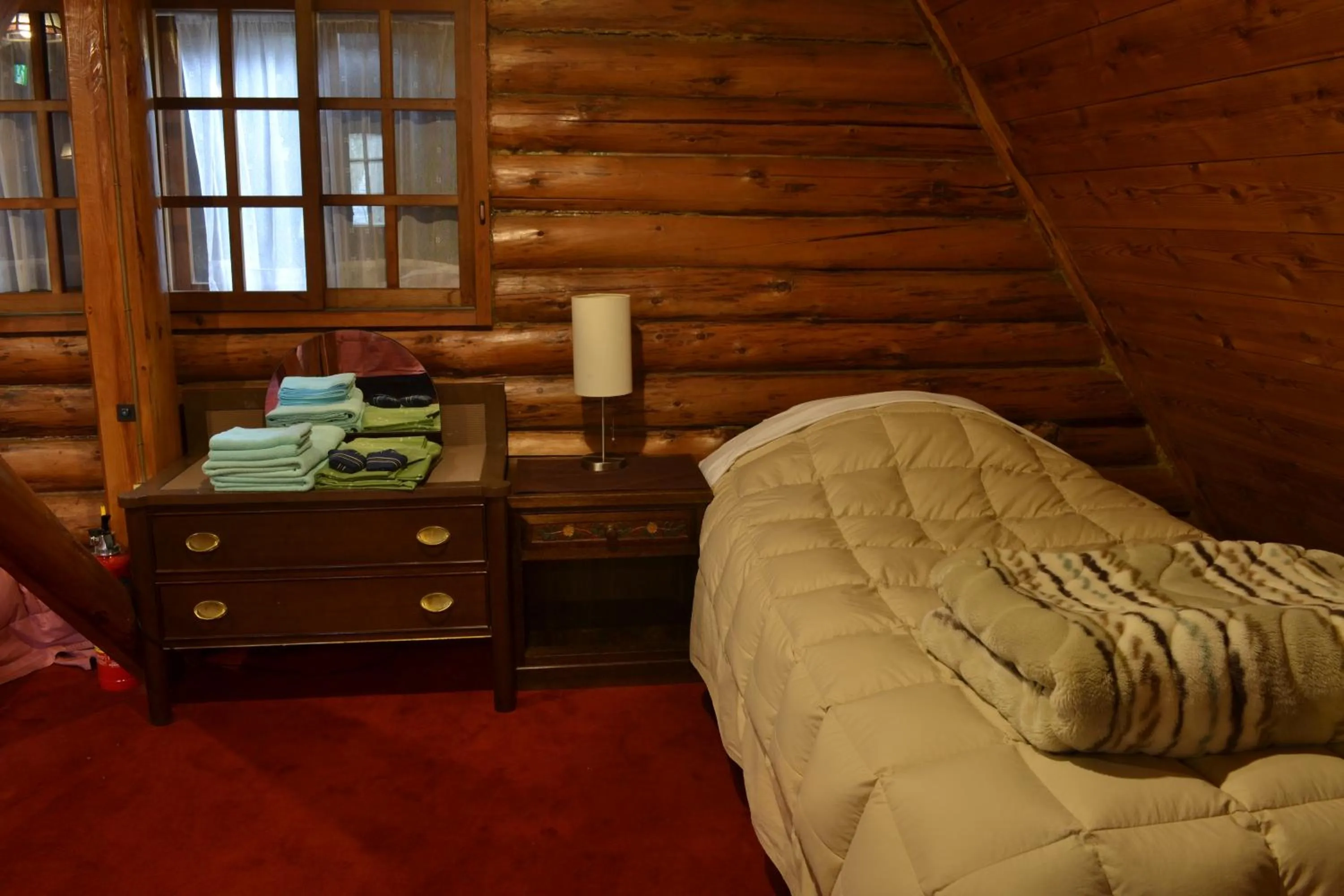 Bed in Hakuba Mominoki Hotel