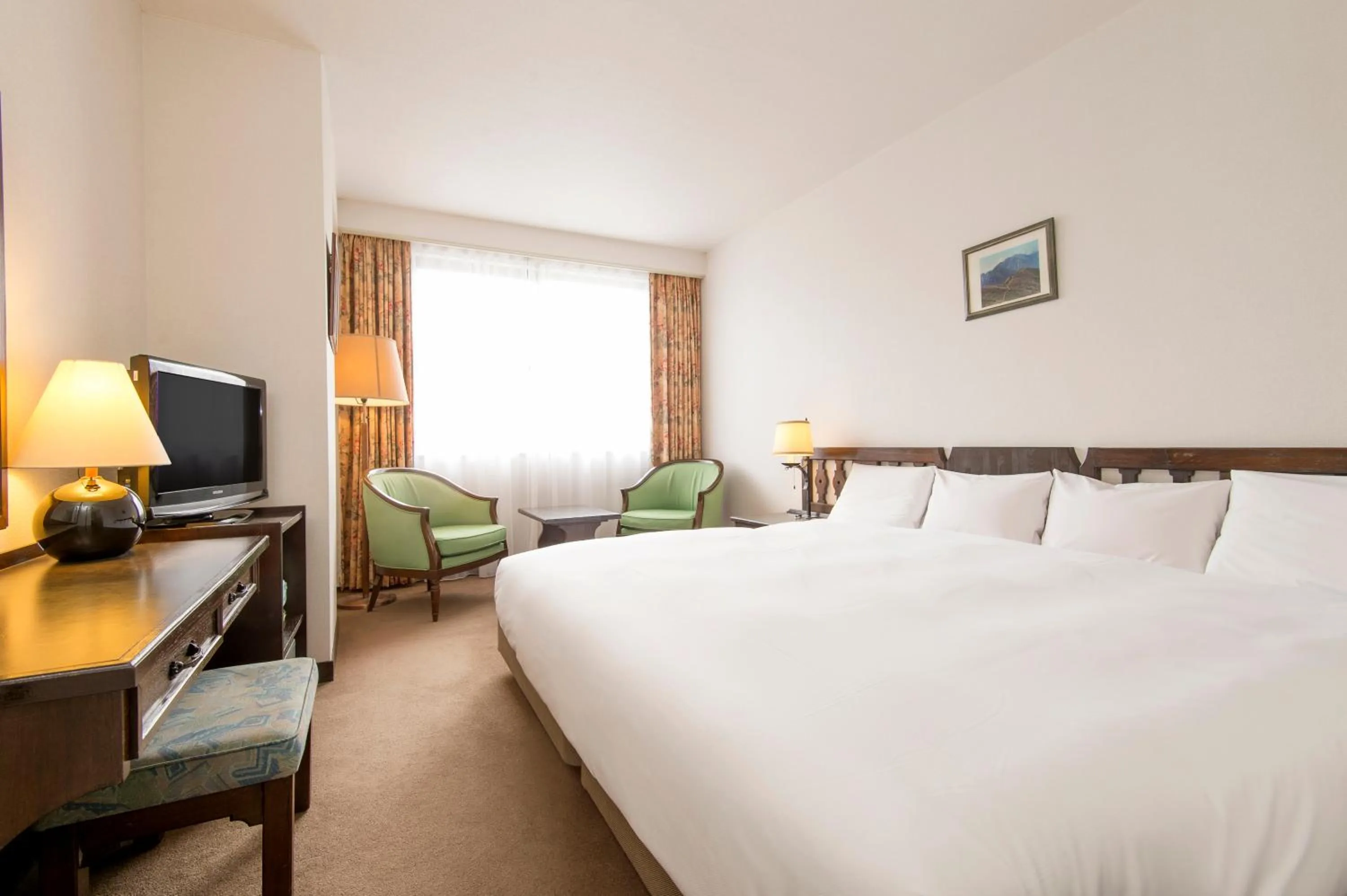 Bed in Hakuba Mominoki Hotel