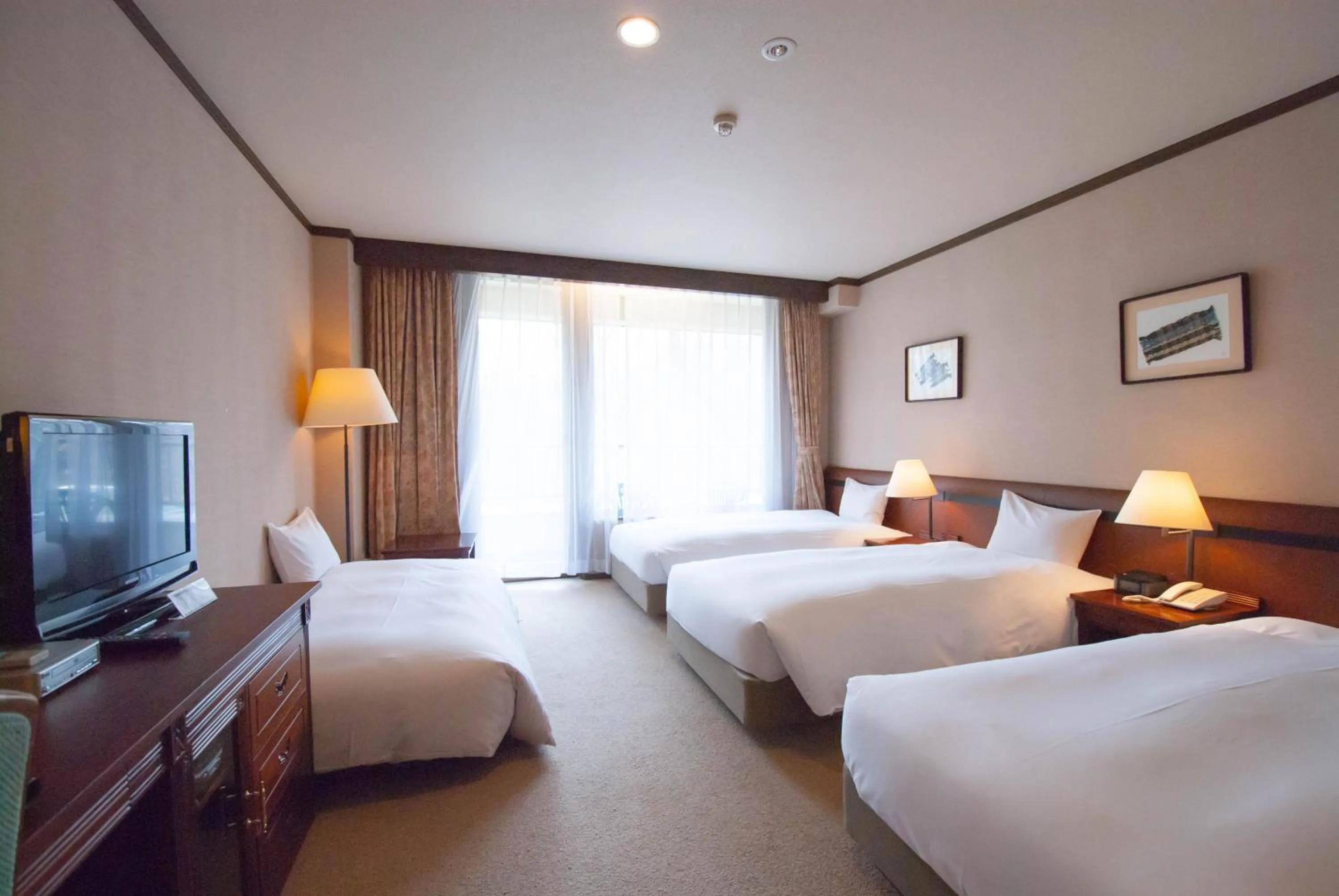 Bed in Hakuba Mominoki Hotel