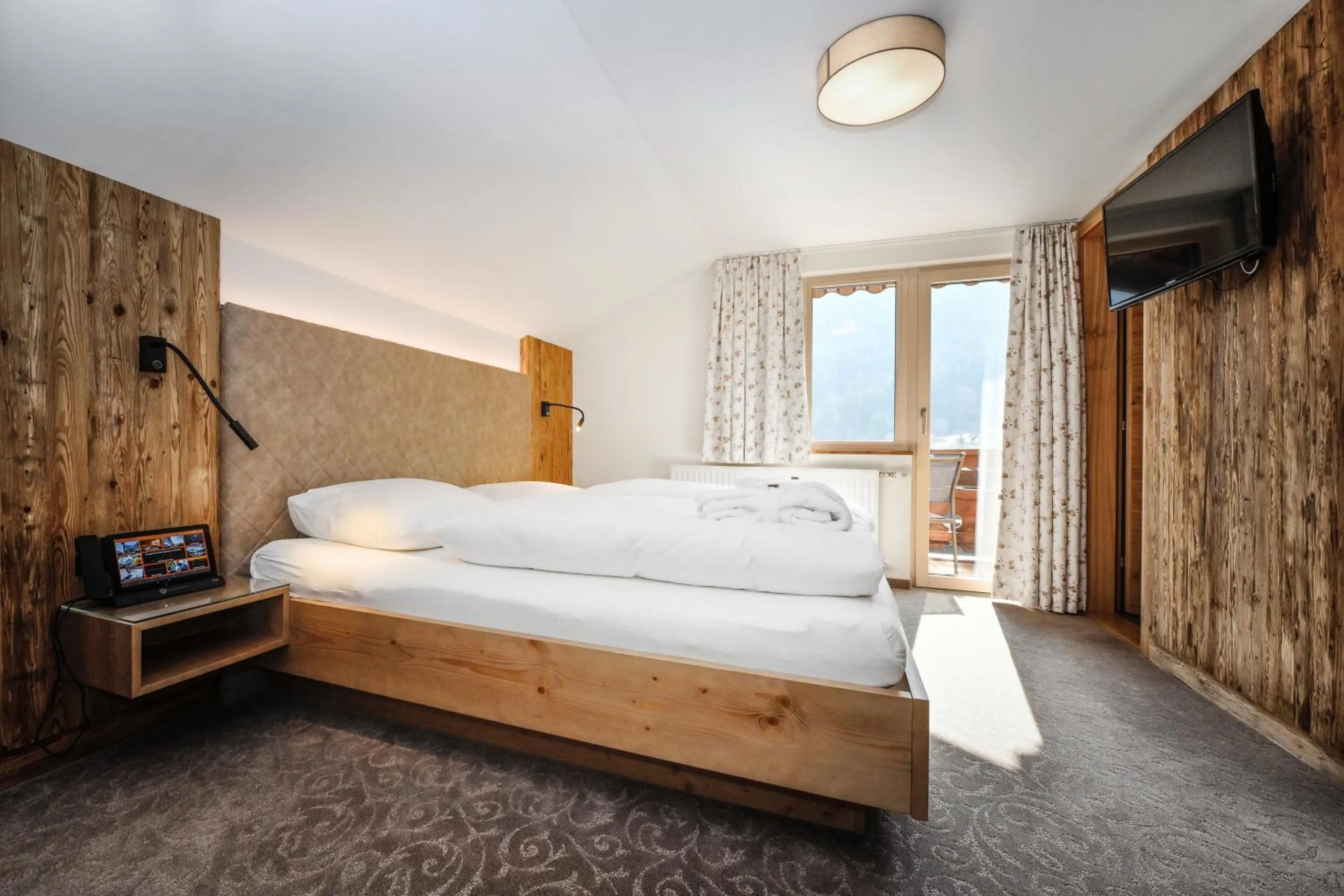 Photo of the whole room, Bed in Hotel Alpenfeuer Montafon