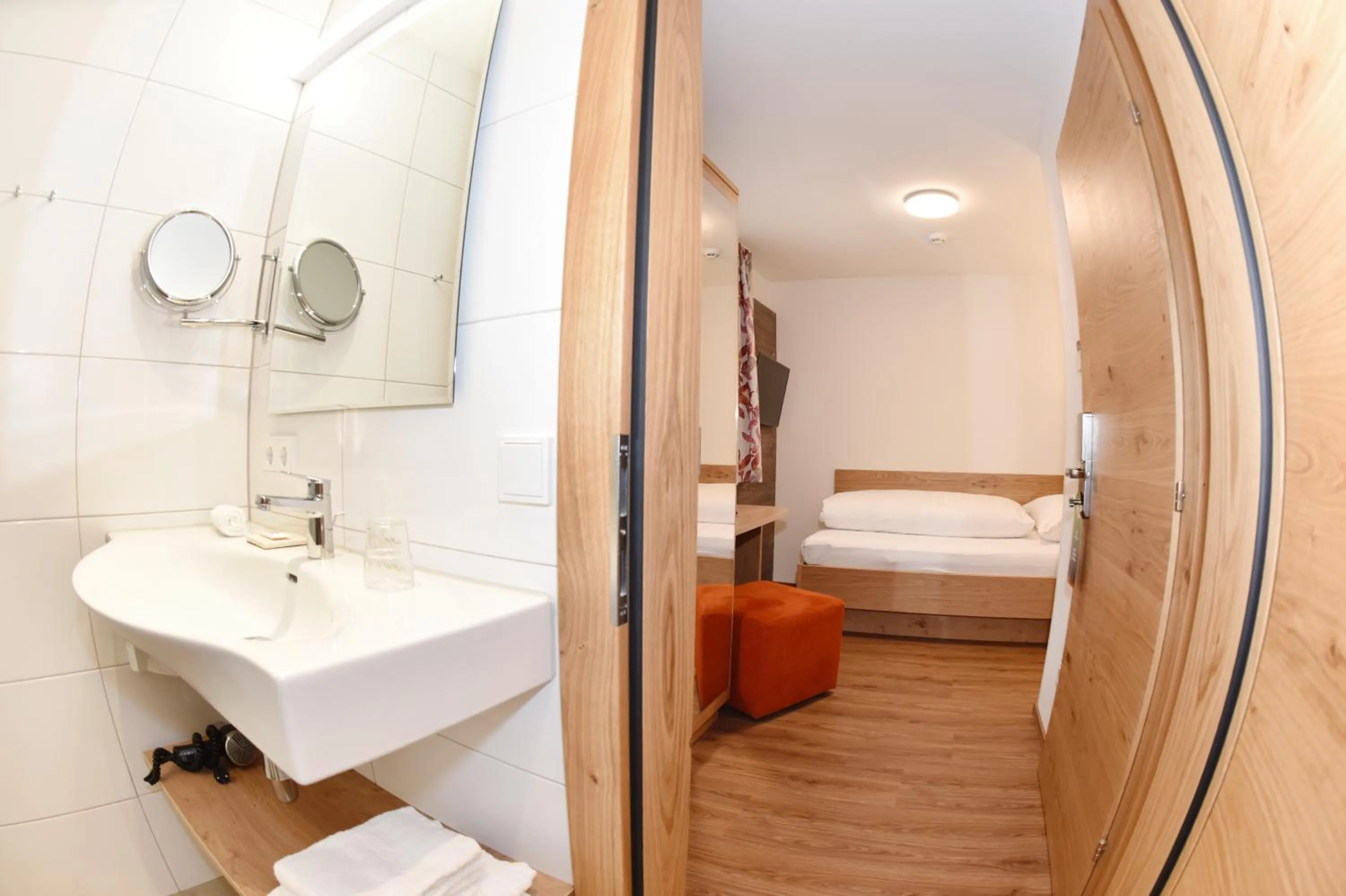 Bathroom, Bed in Hotel Alpenfeuer Montafon