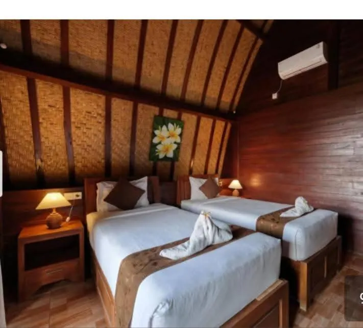 Bed in Bataran Garden Cottage