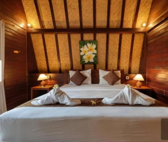 Bed in Bataran Garden Cottage