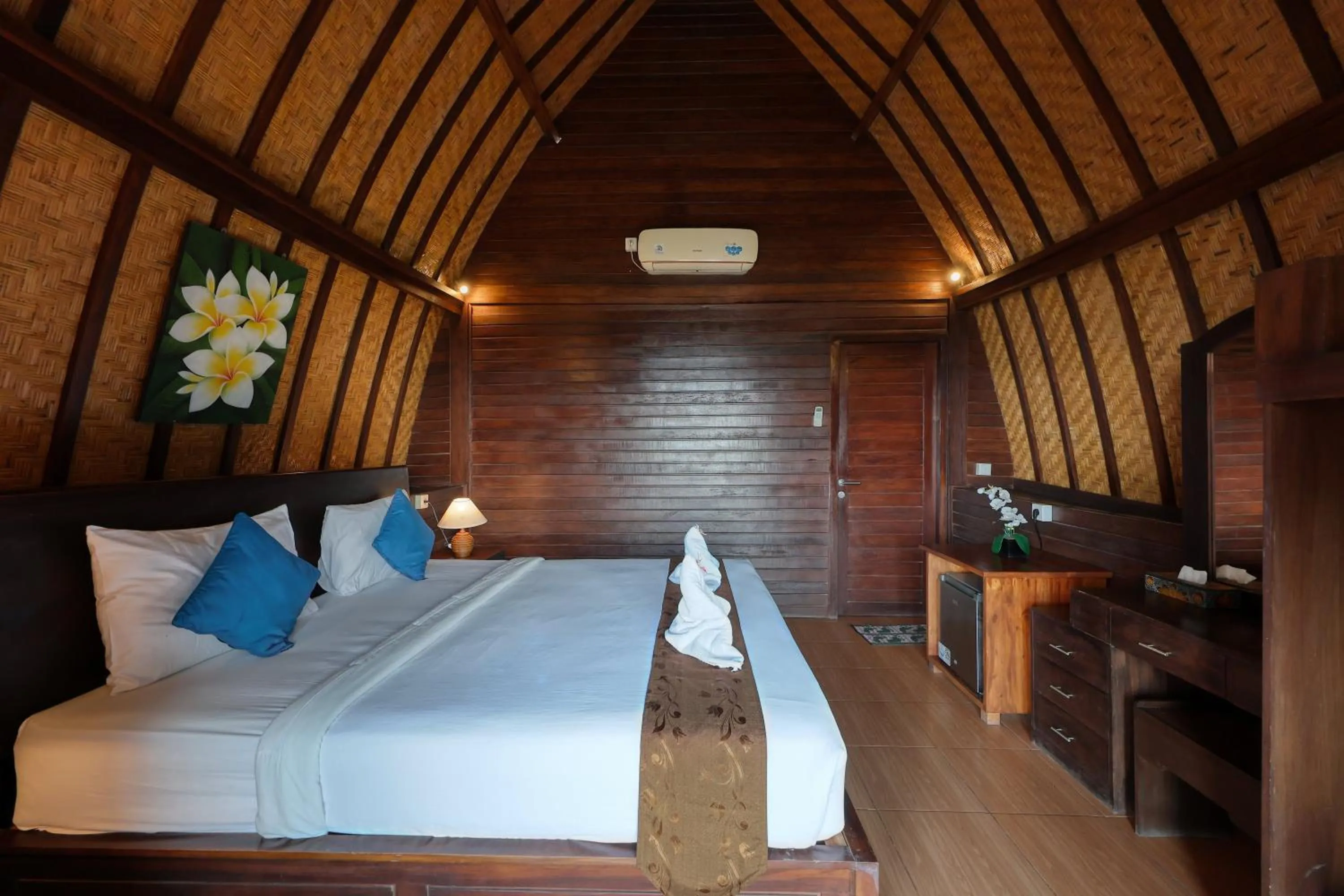 Bed in Bataran Garden Cottage