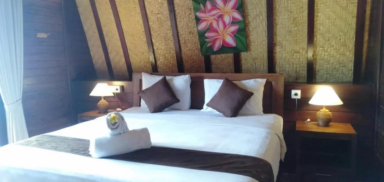 Bed in Bataran Garden Cottage