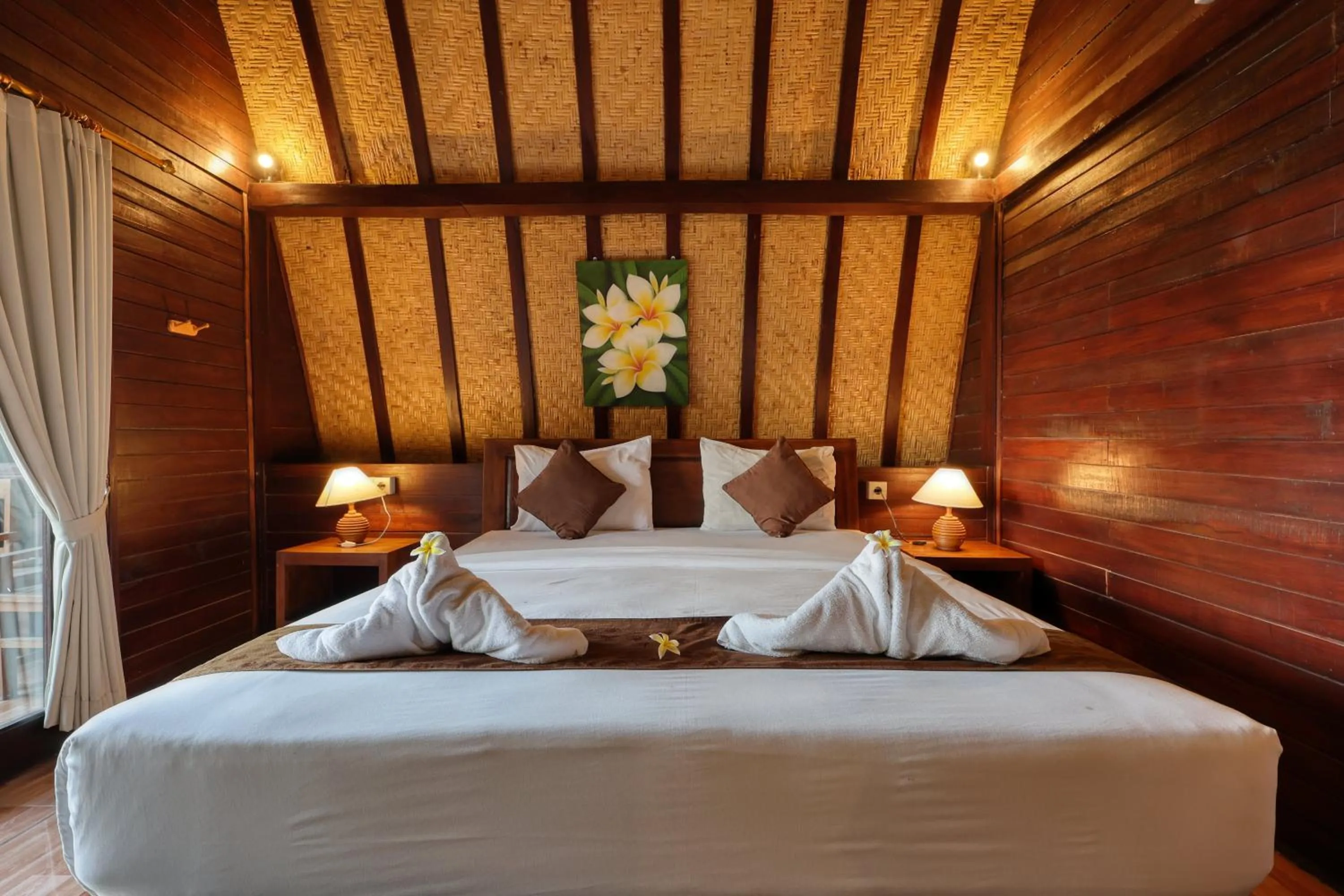 Bed in Bataran Garden Cottage