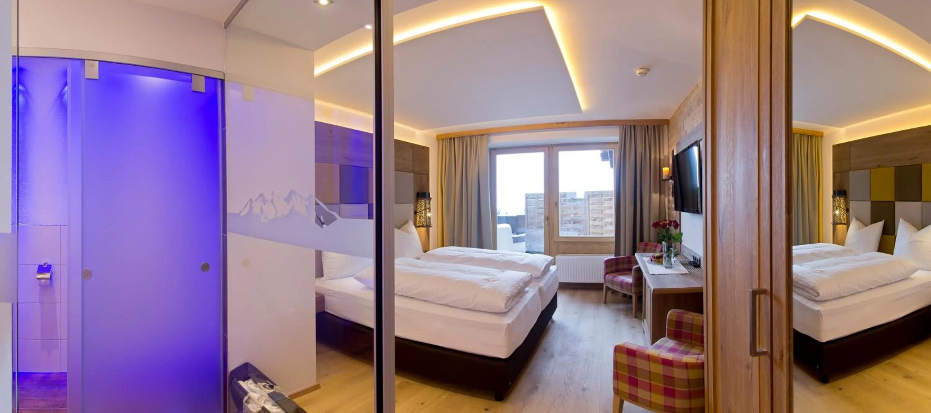 Photo of the whole room, Bed in Sporthotel Ellmau in Tirol