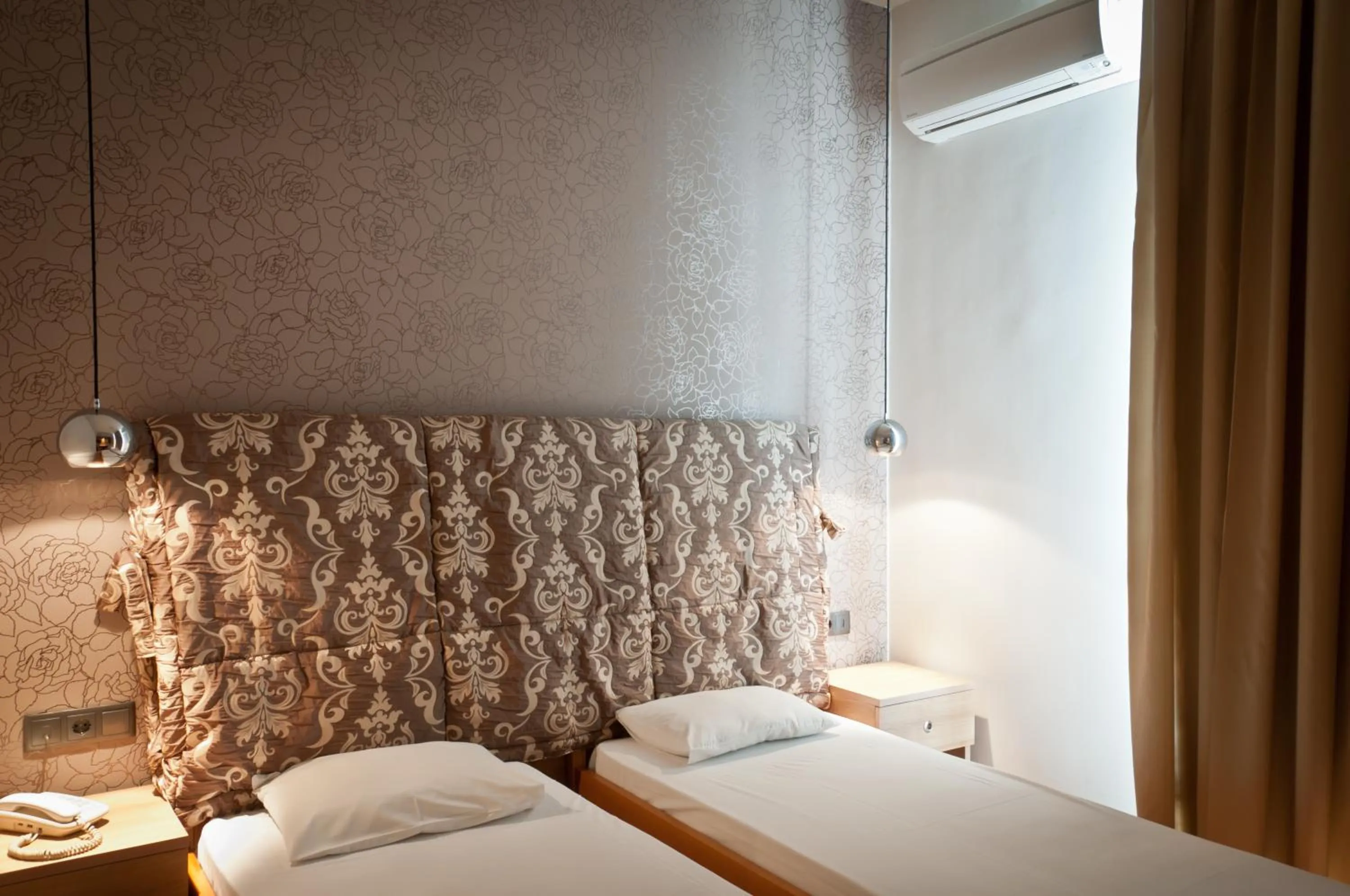 Bed in Metropolis Hotel