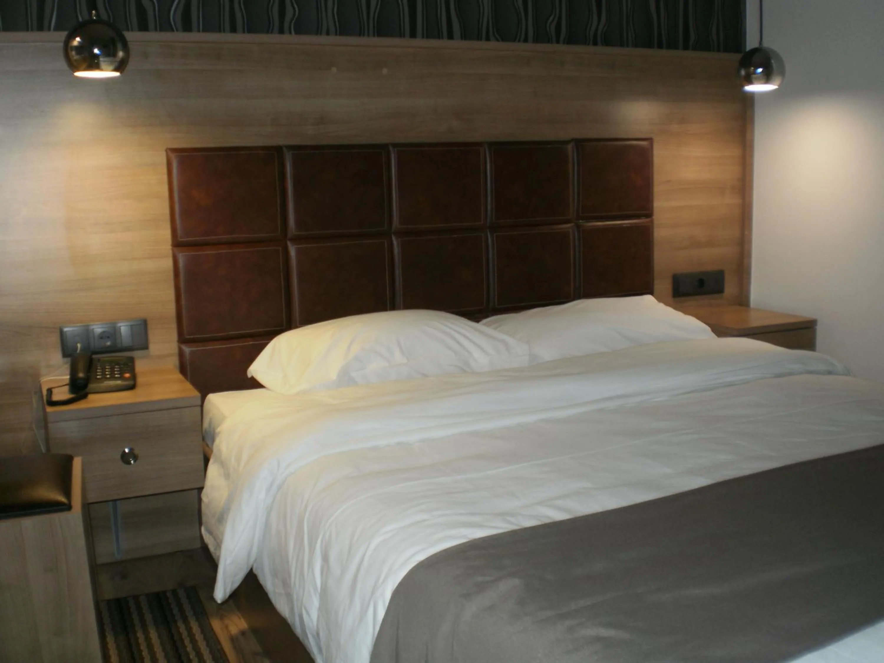 Bed in Metropolis Hotel
