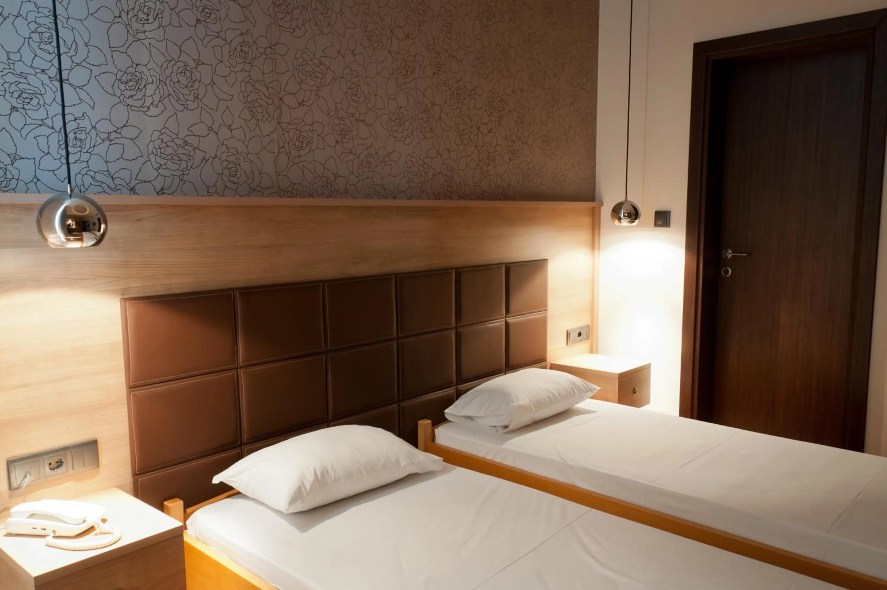 Bed in Metropolis Hotel