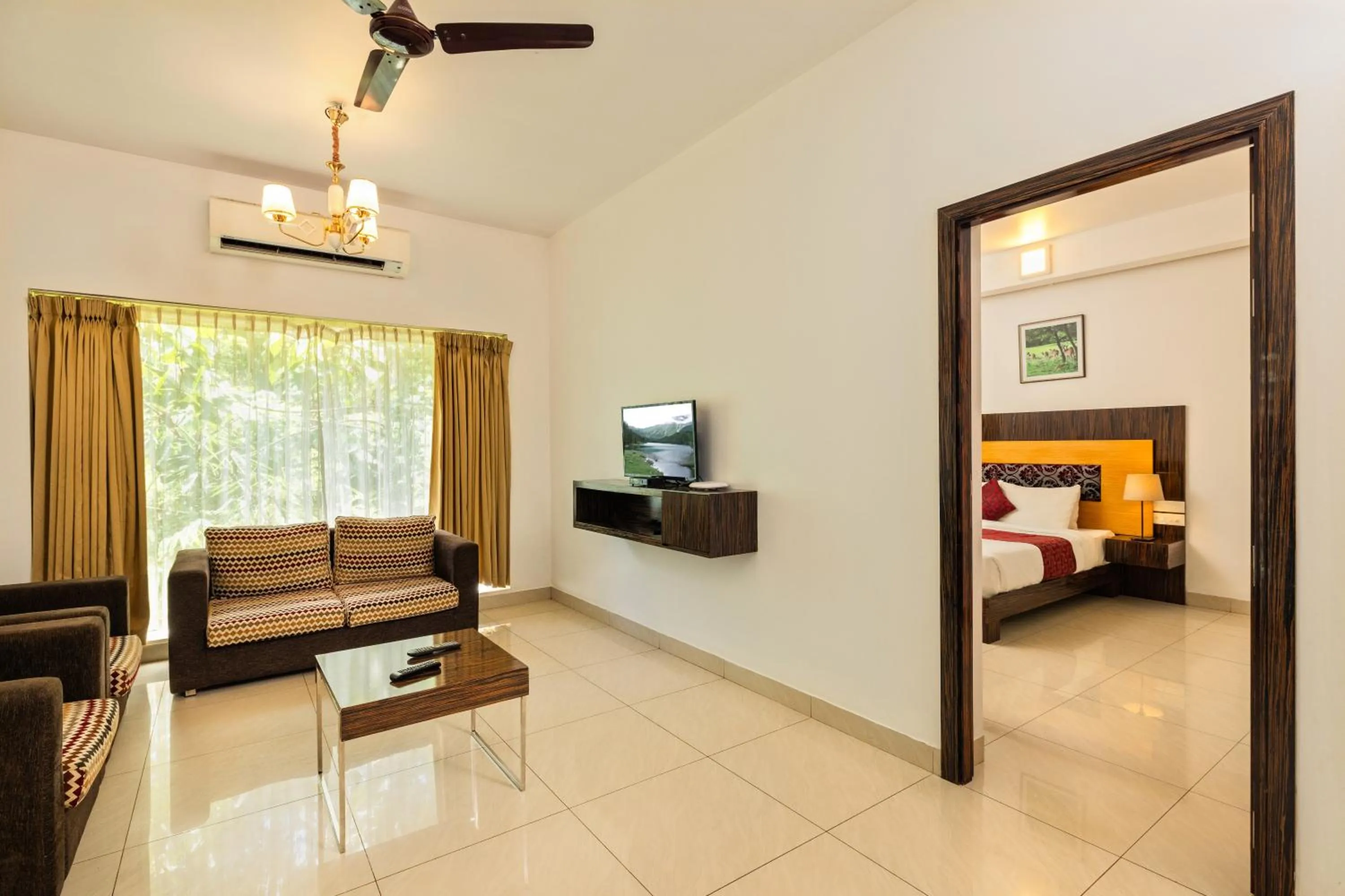 Living room, Bed in Casa Rio Resorts Athirappilly