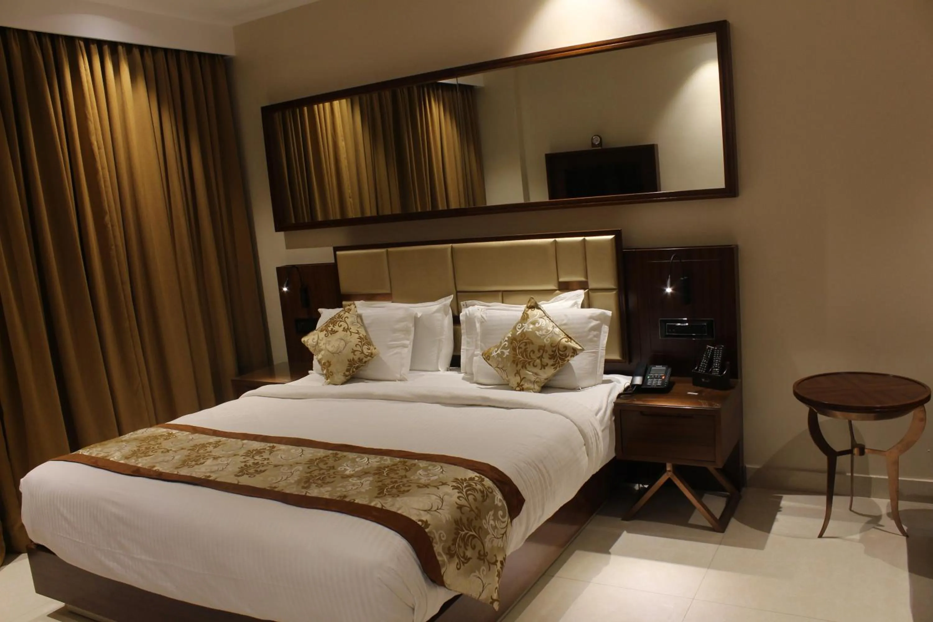 Bed in Mango Hotels Vijayawada