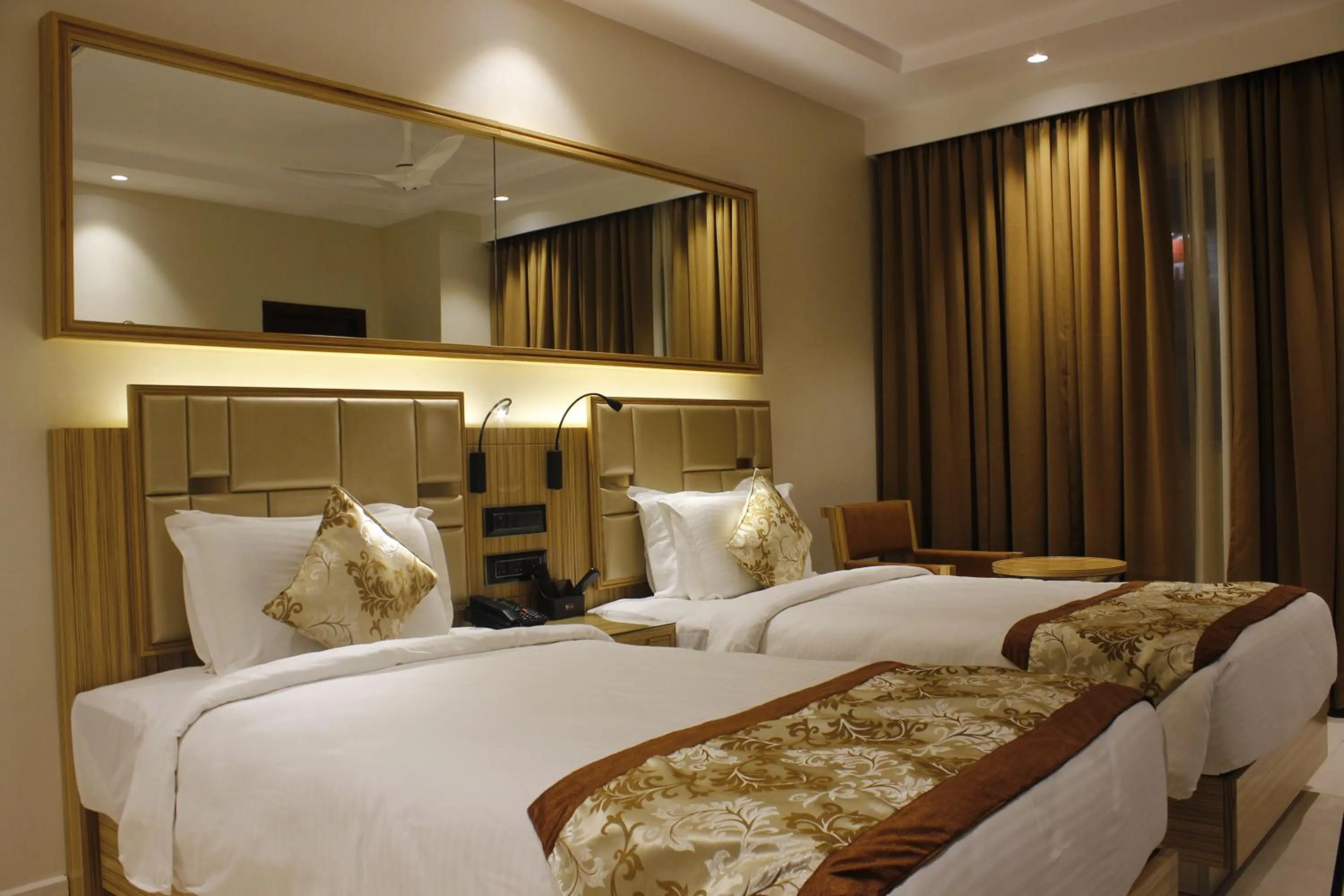 Bed in Mango Hotels Vijayawada