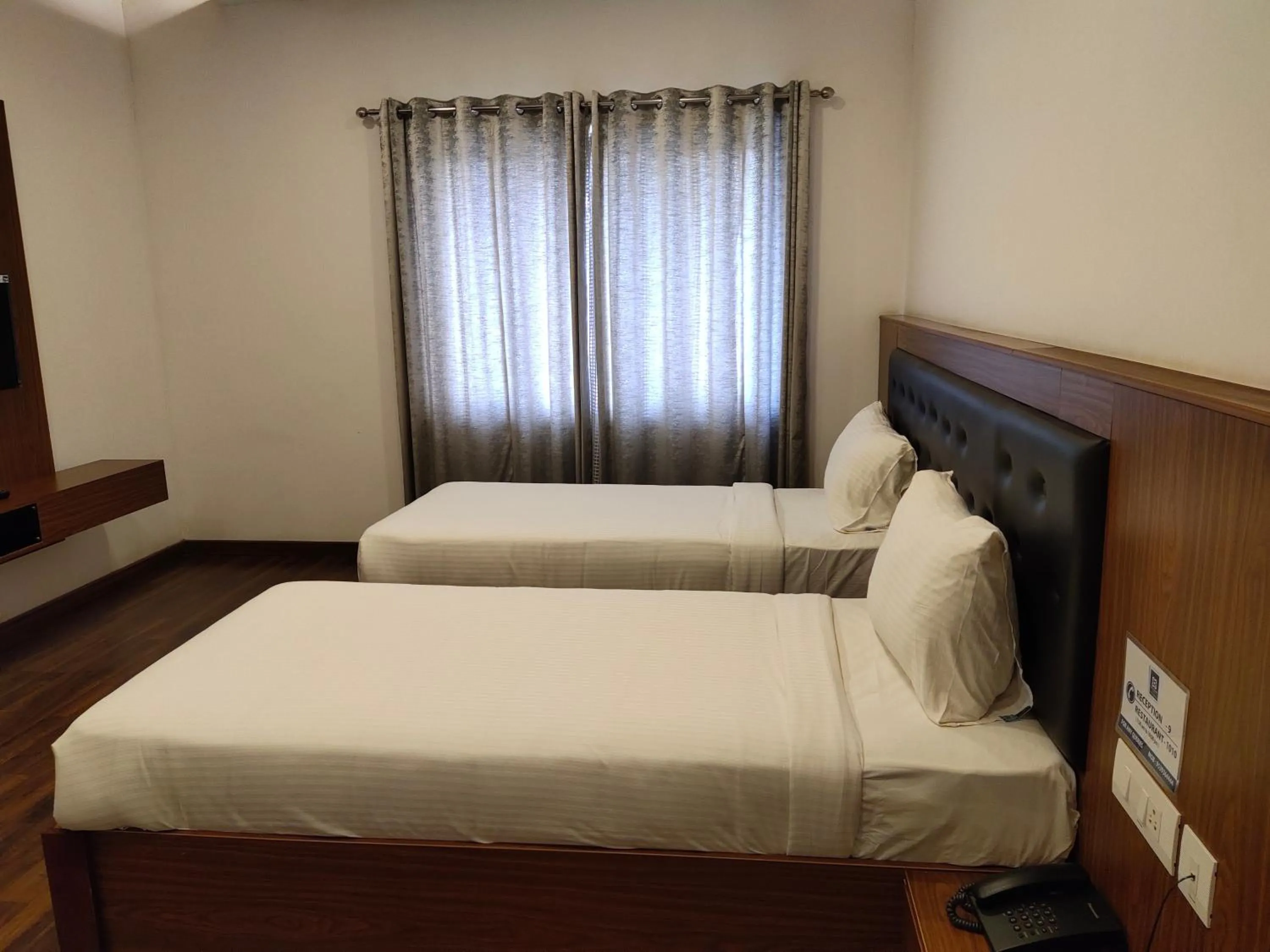 Photo of the whole room, Bed in Four N Square Residency