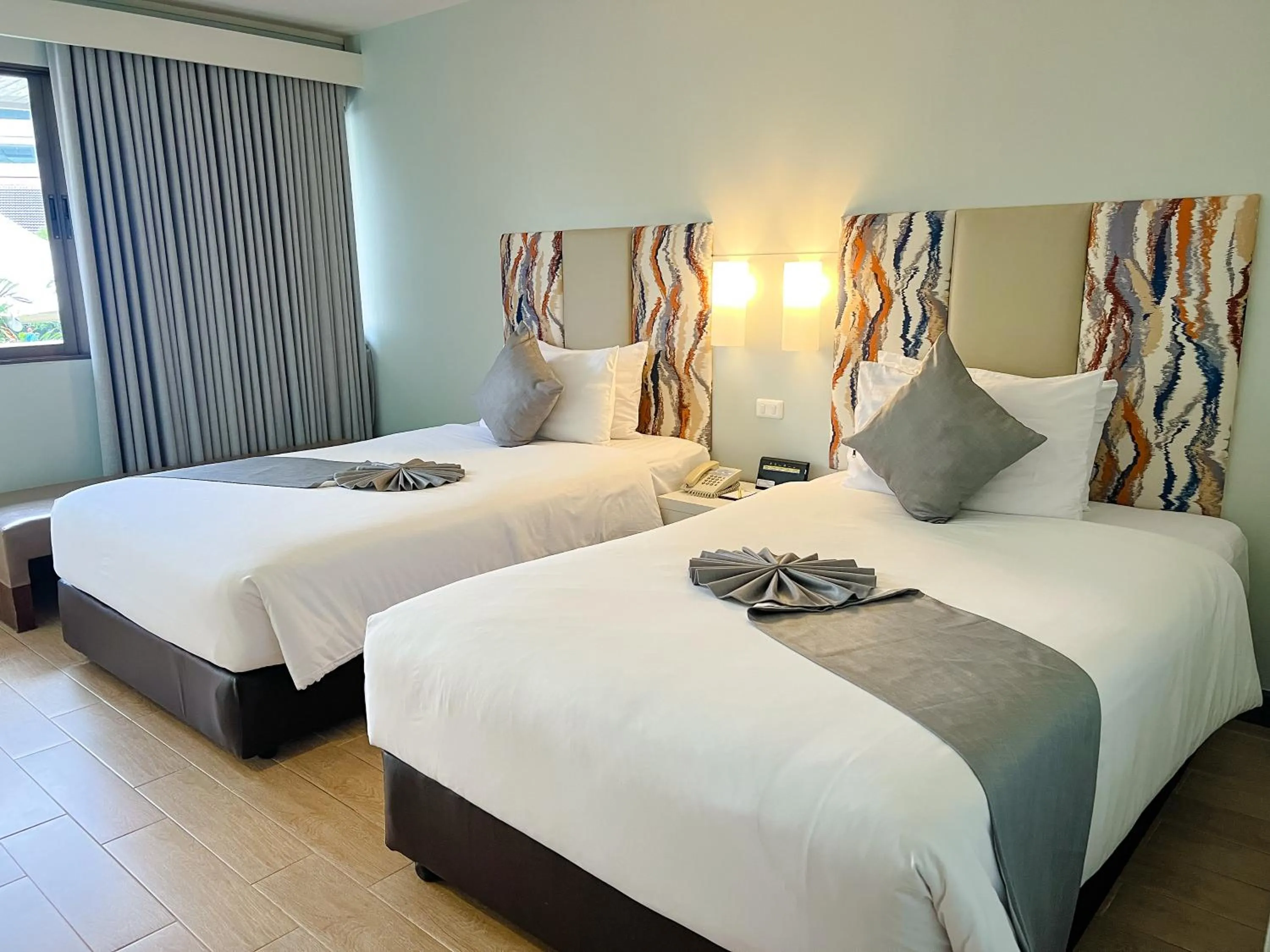 Bed in Patong Resort Hotel - SHA Extra Plus
