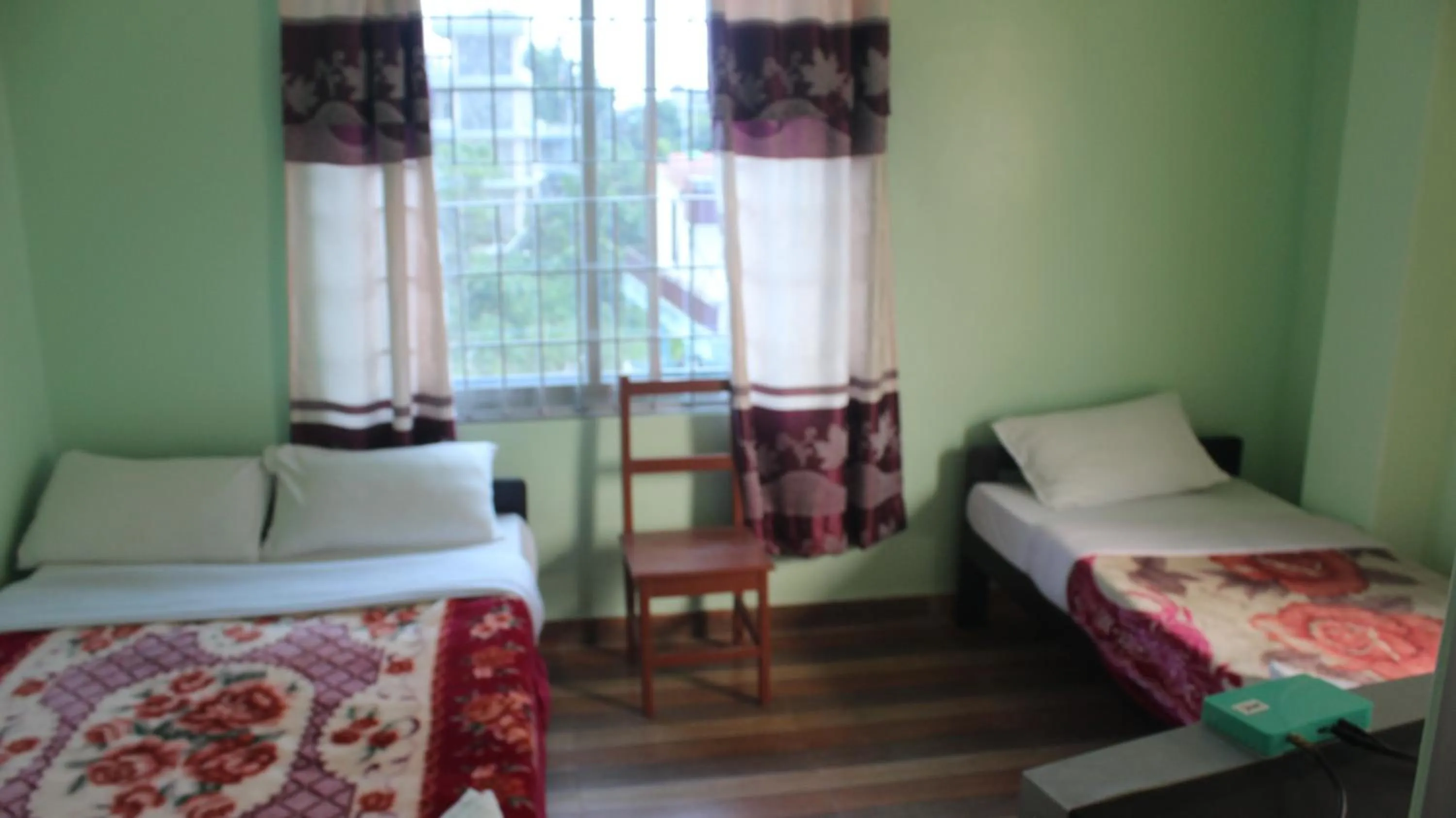 Bed in Harry Guest House & Restaurant