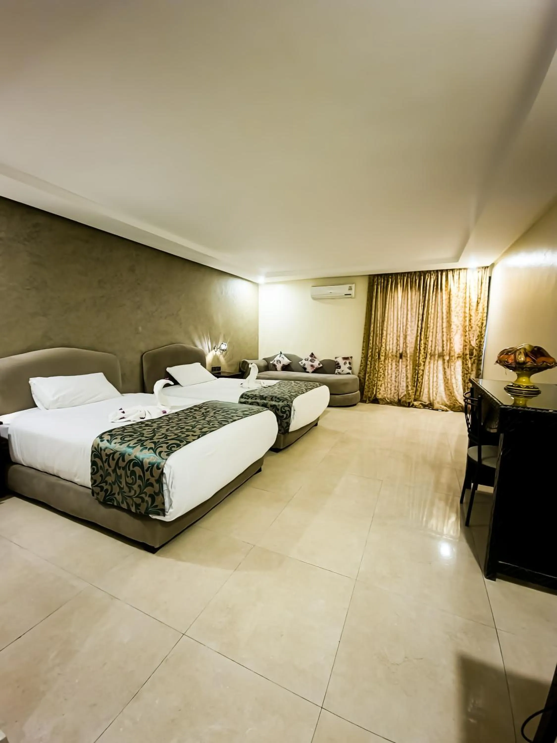 Bed in Palm's Hotel Club