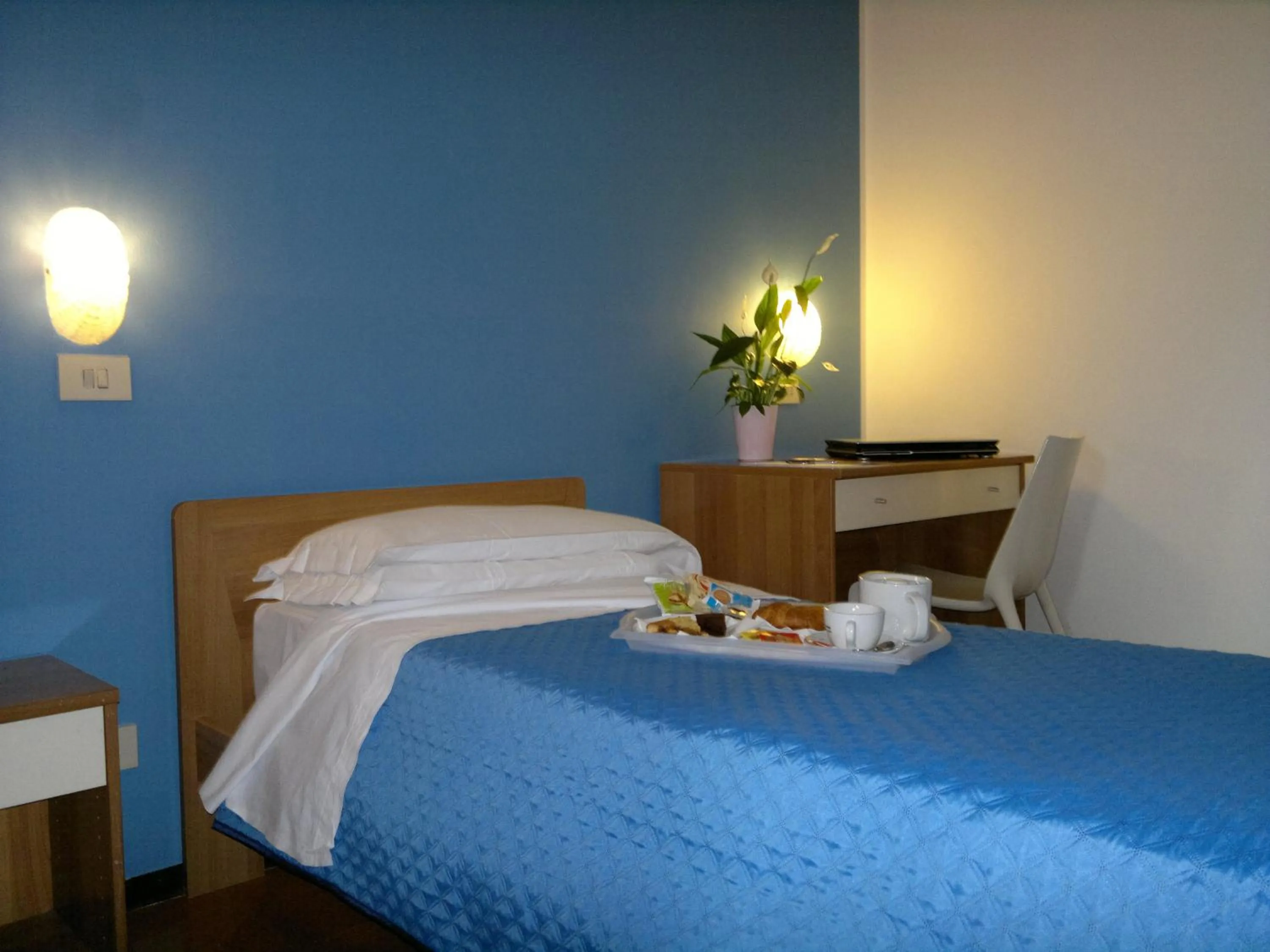 Bed in Albergo Papillon