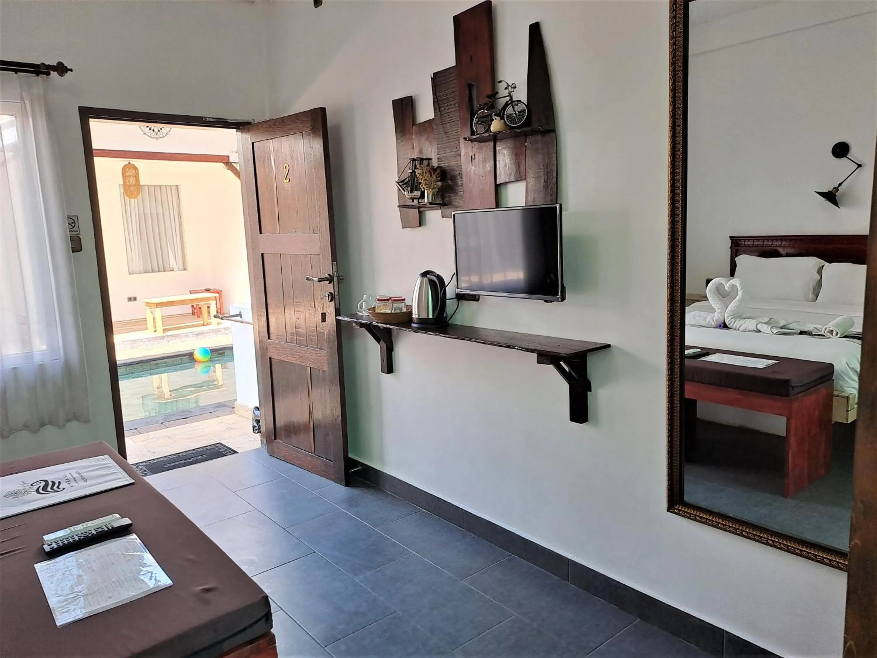 TV and multimedia, Bed in Katara Gili, Boutique Rooms and Bungalows