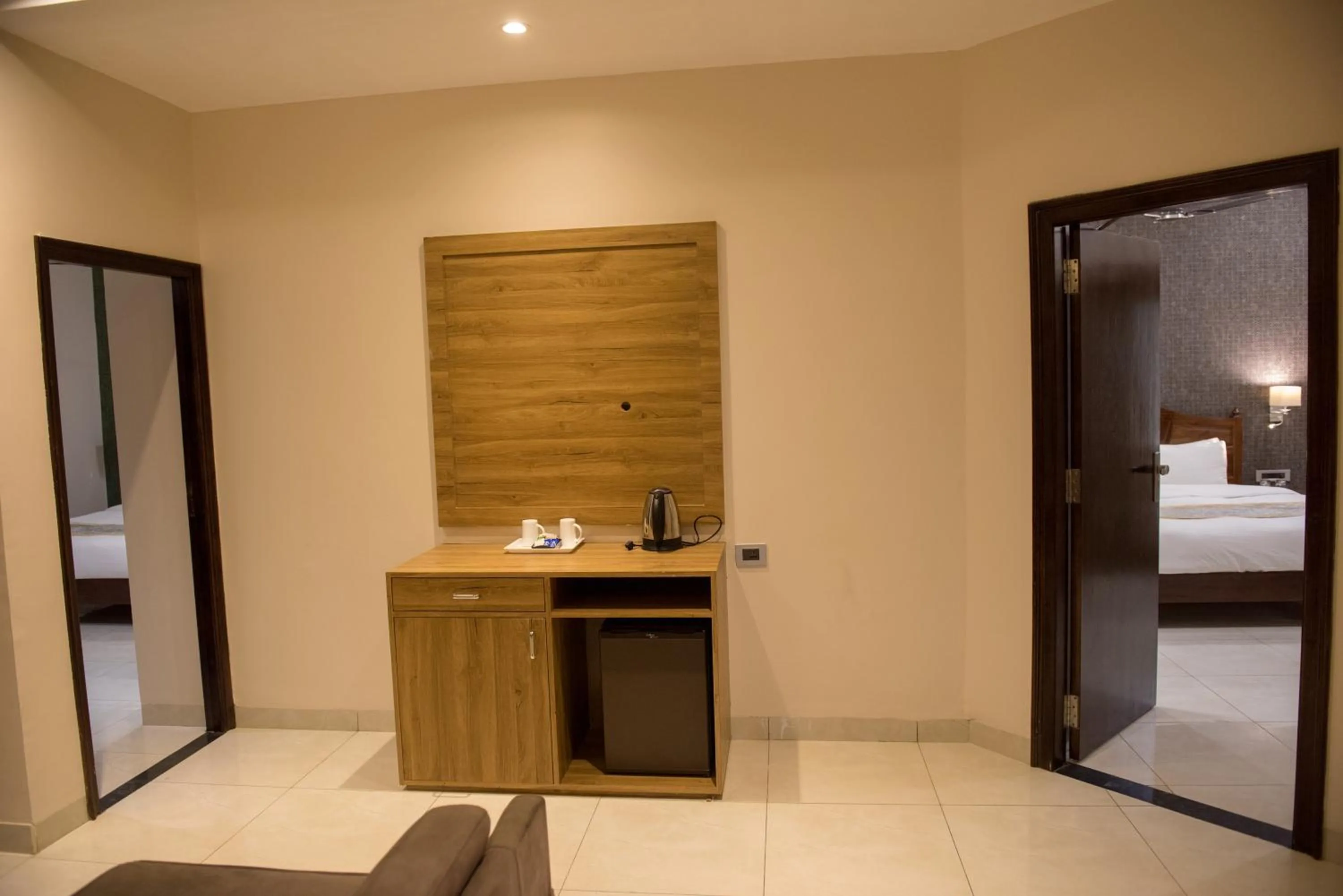 Kitchen or kitchenette, Bed in Sun Hotel and Resort, Mount Abu