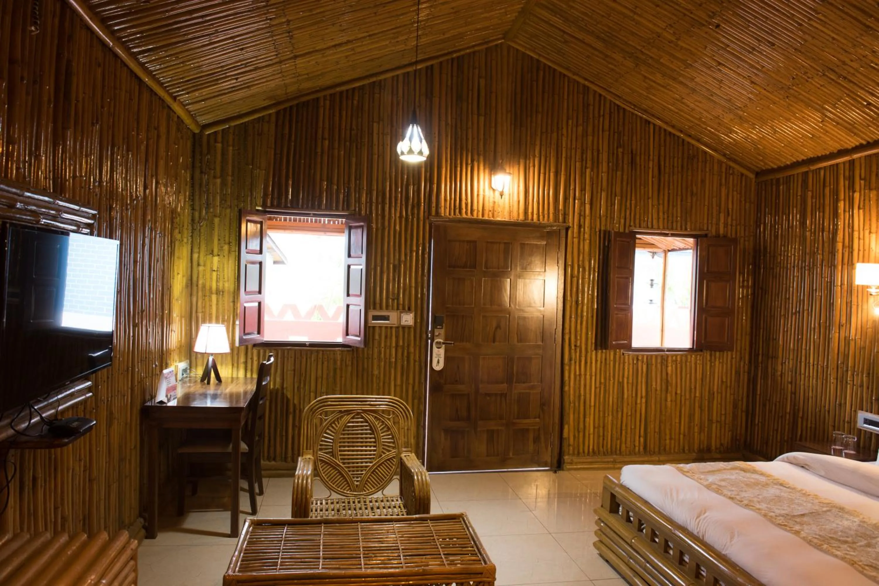 Seating area, Bed in Sun Hotel and Resort, Mount Abu