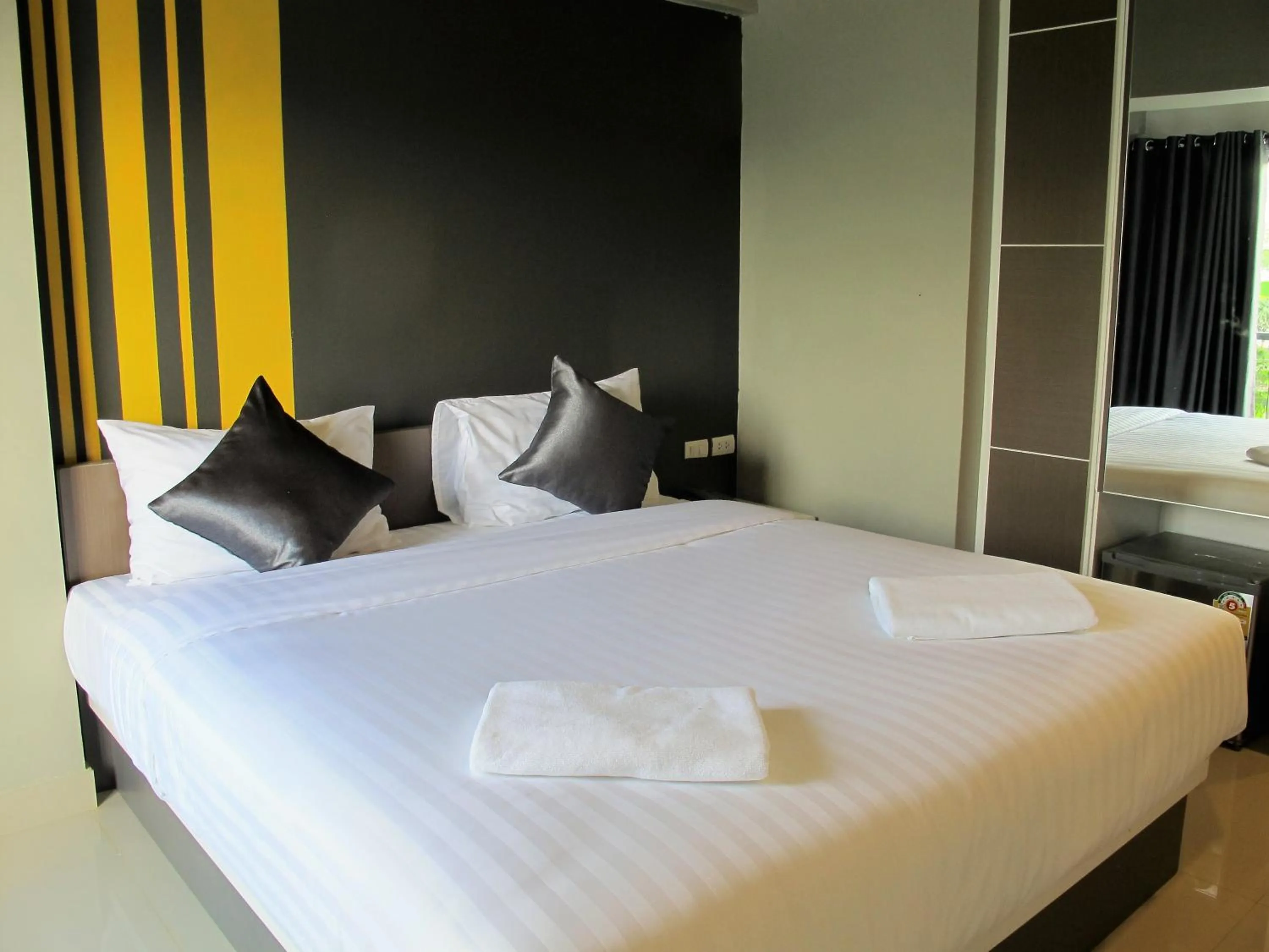 Bed in Suvarnabhumi Oriental Resort