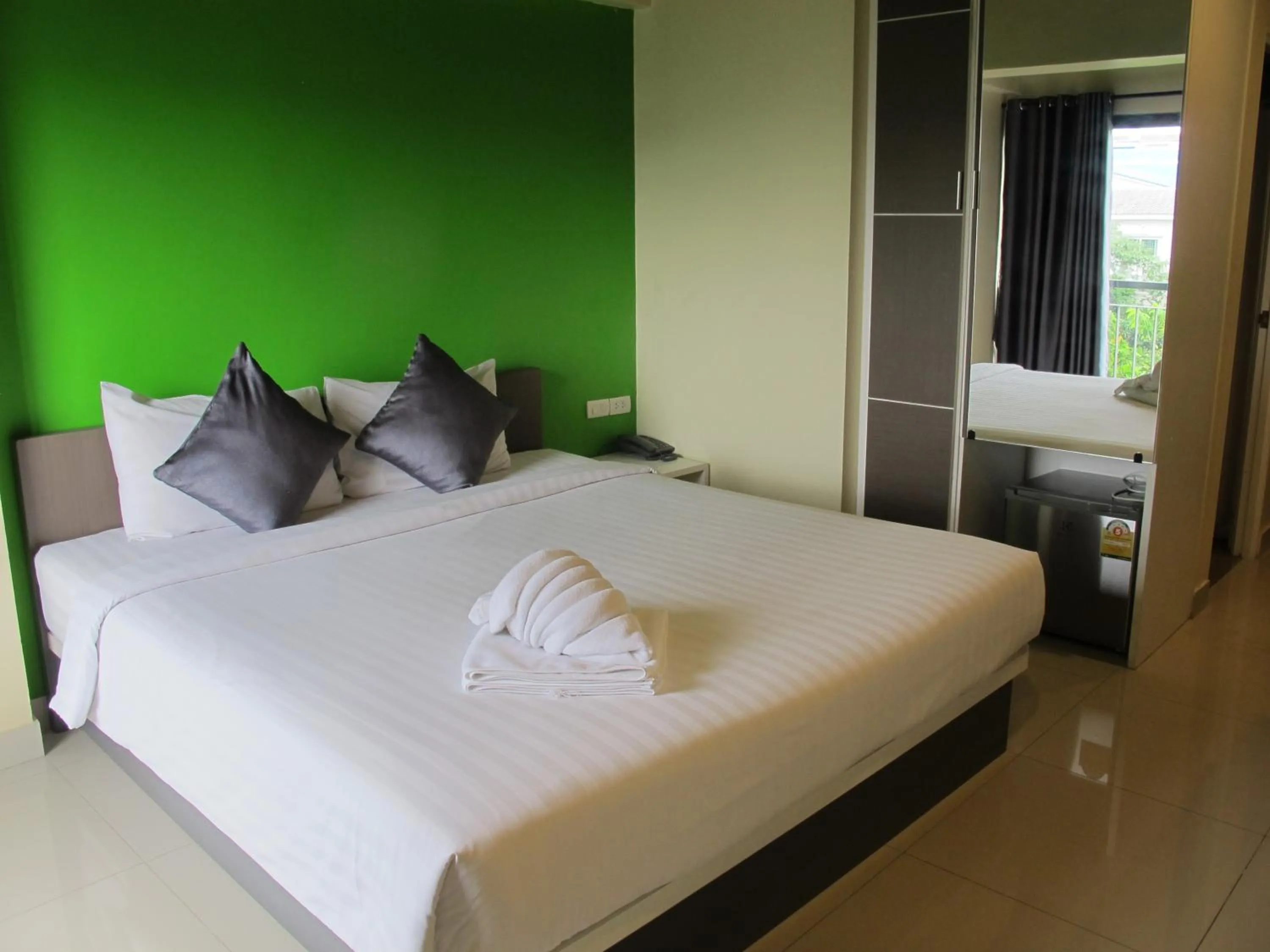 Bed in Suvarnabhumi Oriental Resort