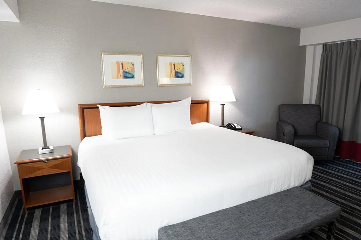 Bed in Atrium Hotel and Suites DFW Airport