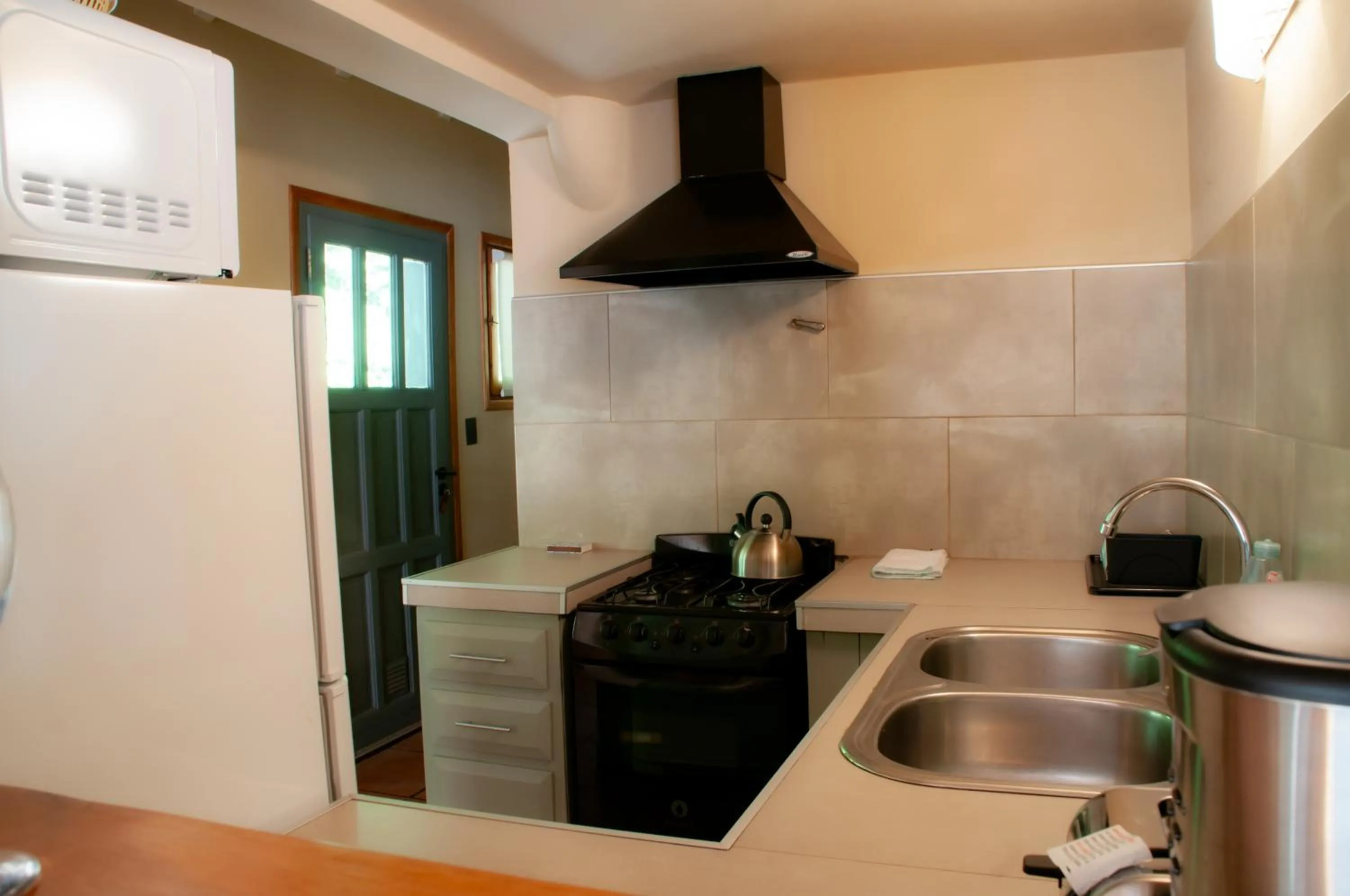 kitchen in Las Cumbres Apart & Suites