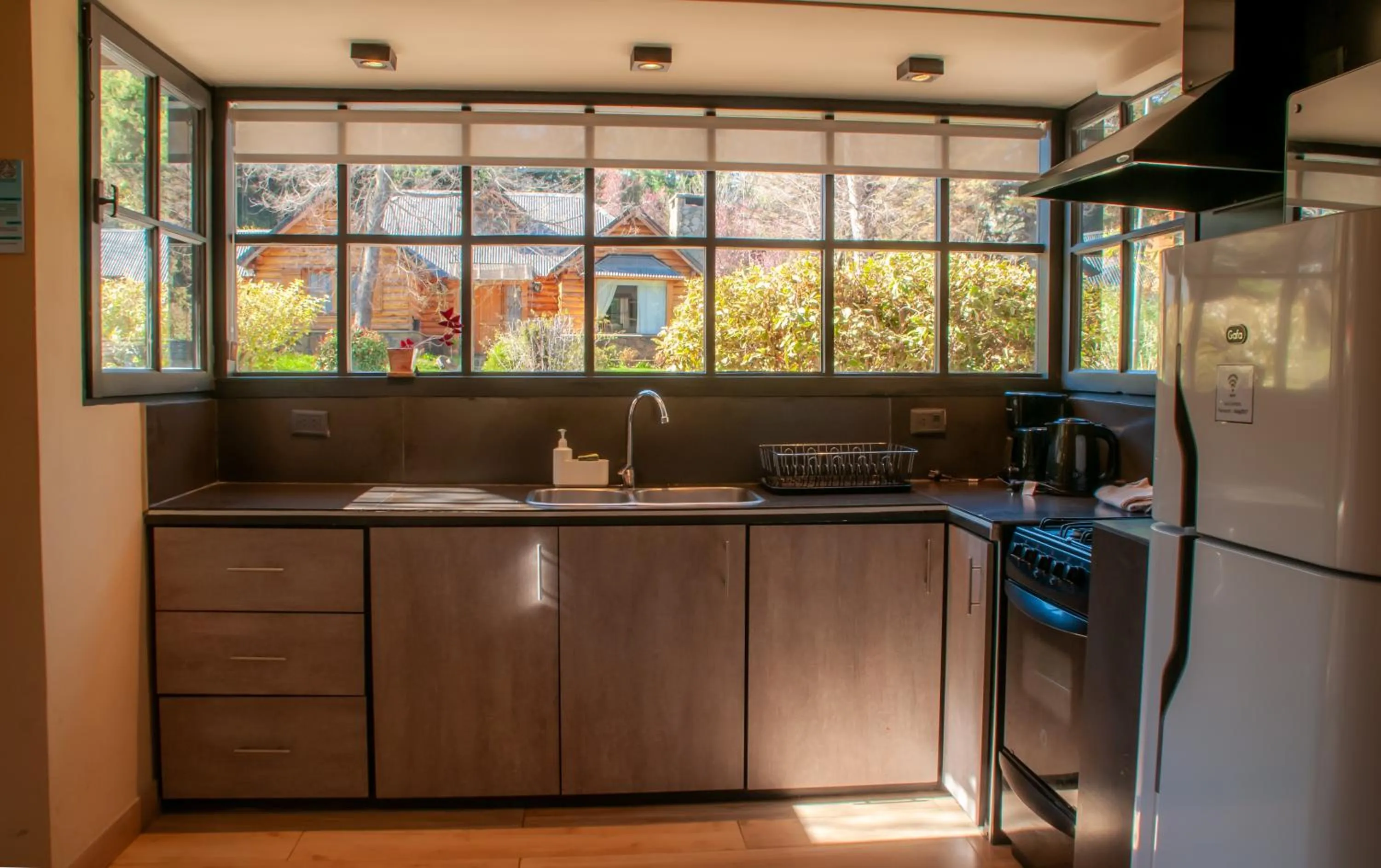 Kitchen or kitchenette in Las Cumbres Apart & Suites