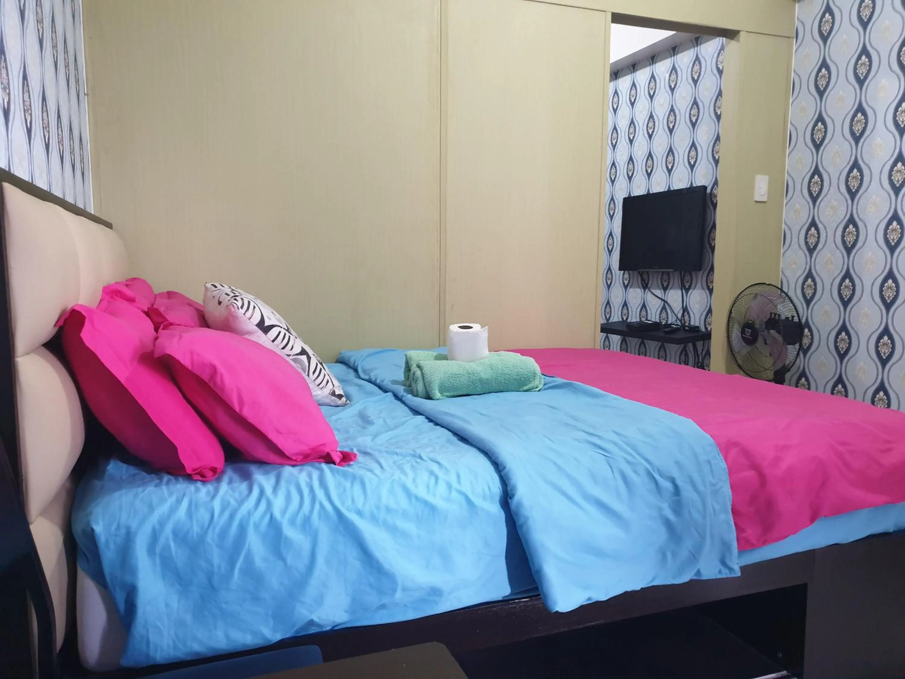 Bed in Wind Residences by Bea and RM