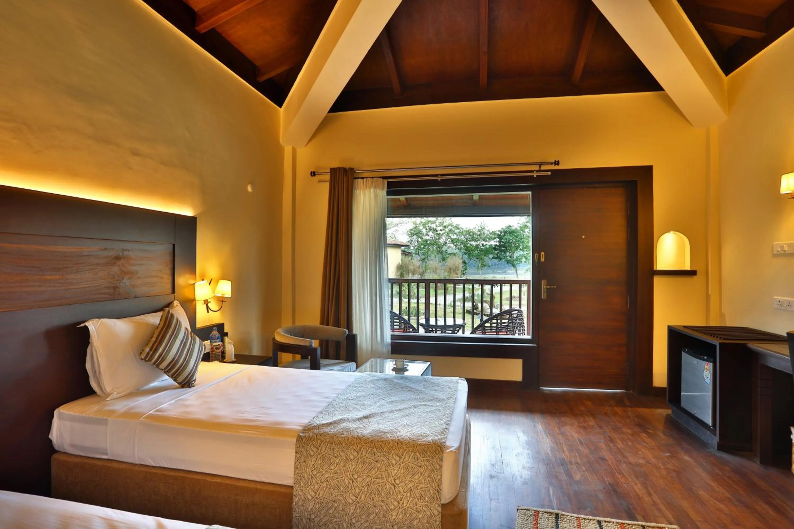 Balcony/Terrace, Bed in Jungle Villa Resort - Near Chitwan National Park