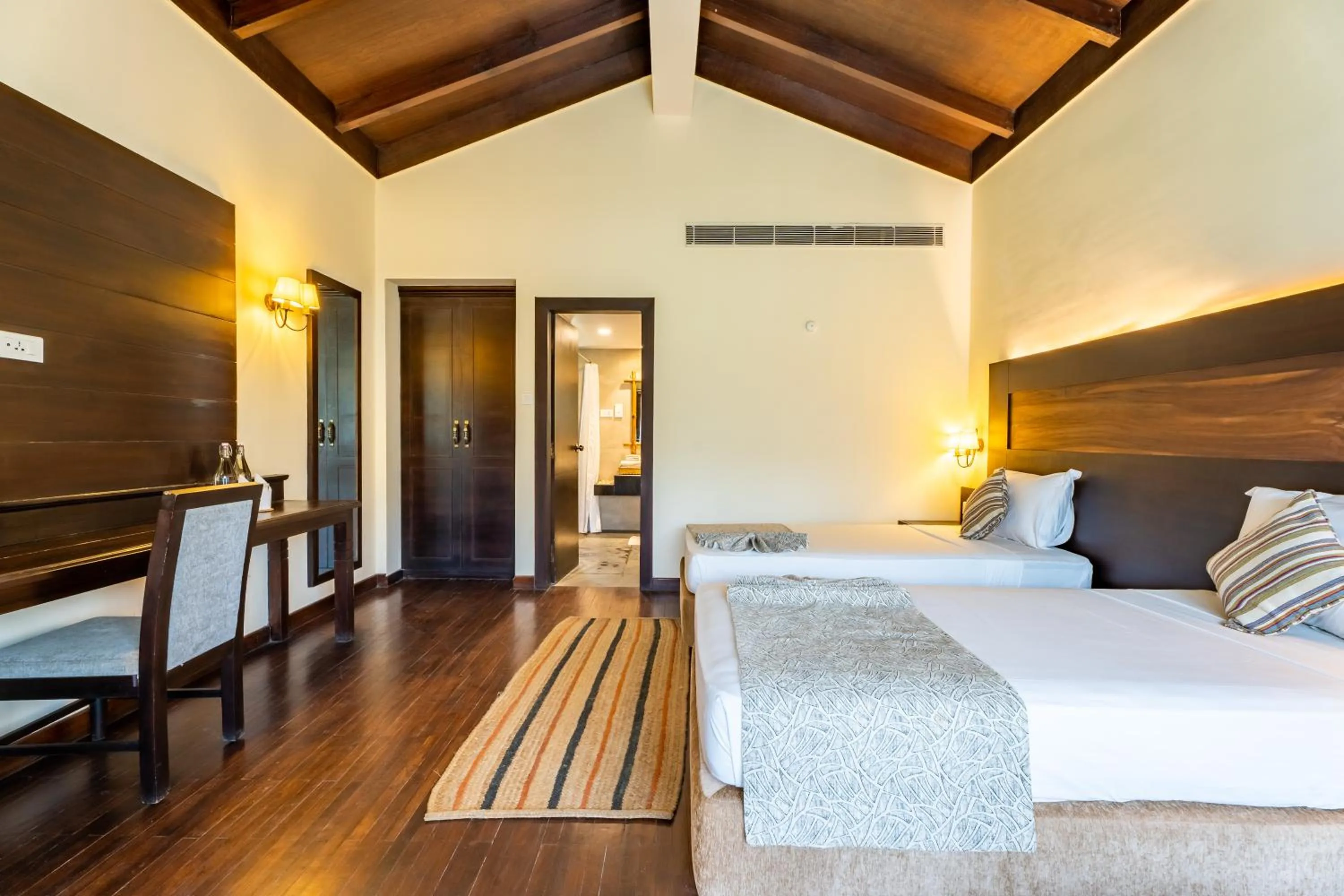 Bedroom, Bed in Jungle Villa Resort - Near Chitwan National Park