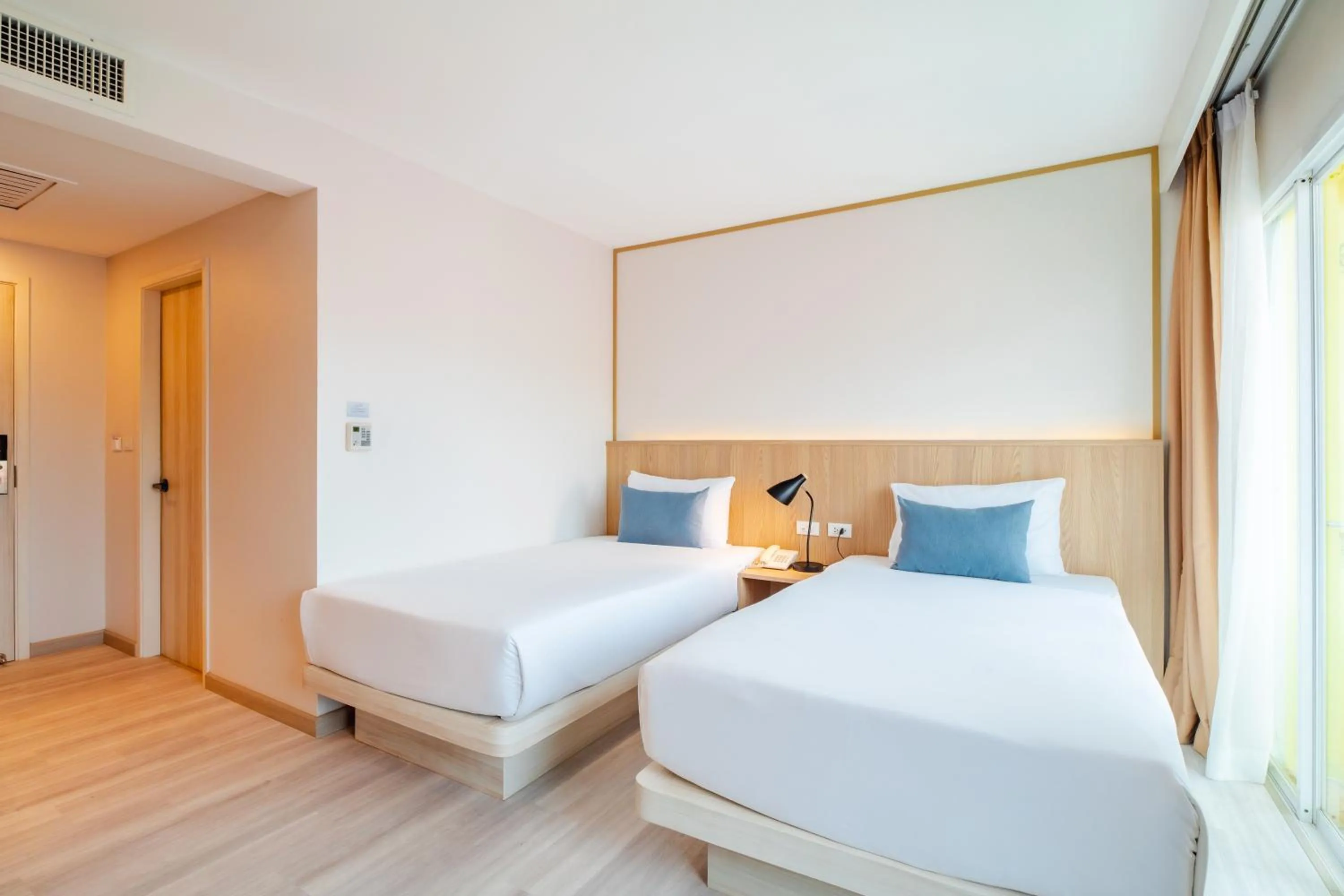 Bed in Baumancasa Beach Resort